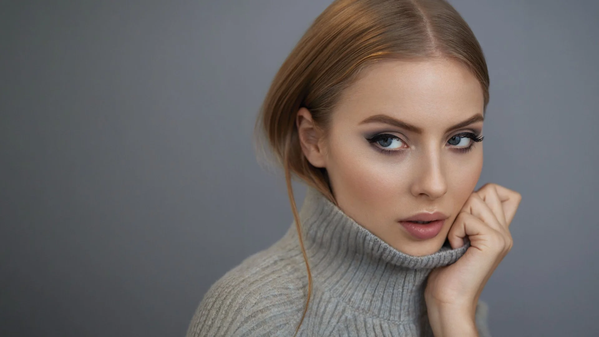 Studio portrait of woman with softly sculpted brows and defined eyes