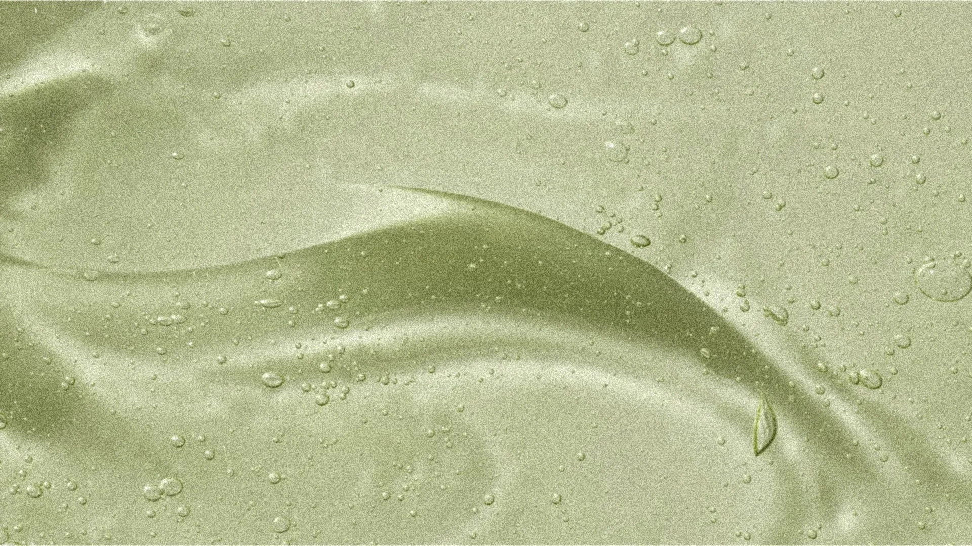 Close-up of a smooth, light green bodywash