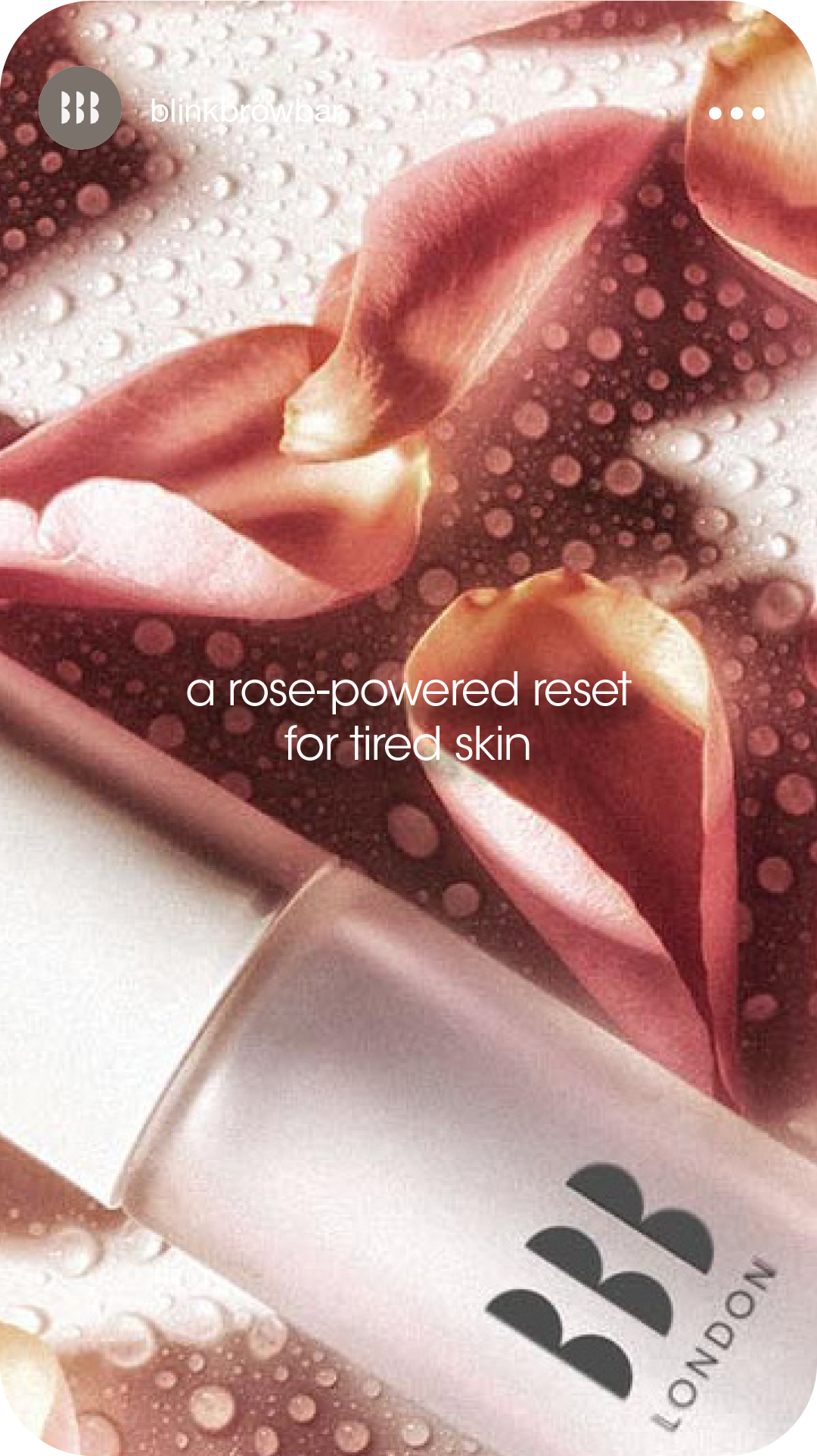 A close-up of a pink lipstick with water droplets around it and a blush pink packaging with the London logo. Overlaid text says 'a rose-powered reset for tired skin.'