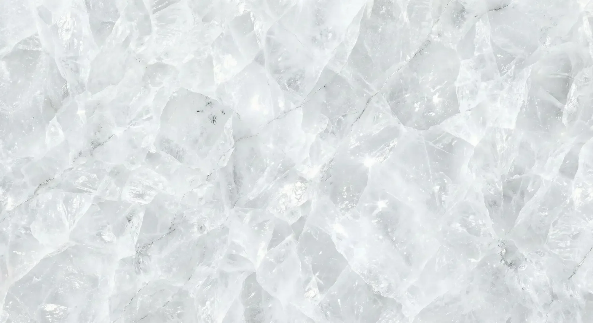 Close-up of translucent Cristallo Quartzite stone texture. Icy white crystal structure suitable for backlit countertops and luxury feature walls.