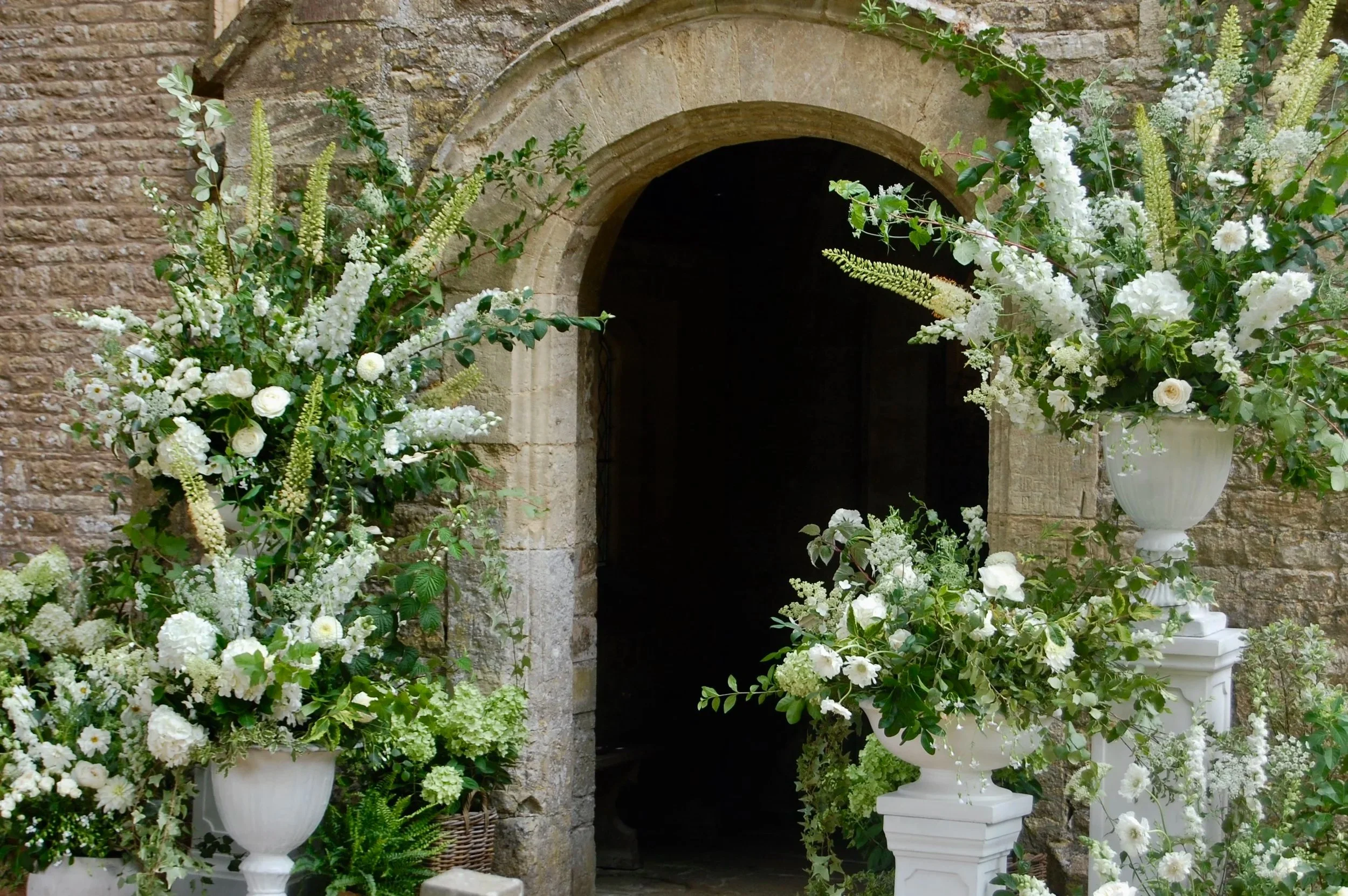 church entrance white floral arrangement