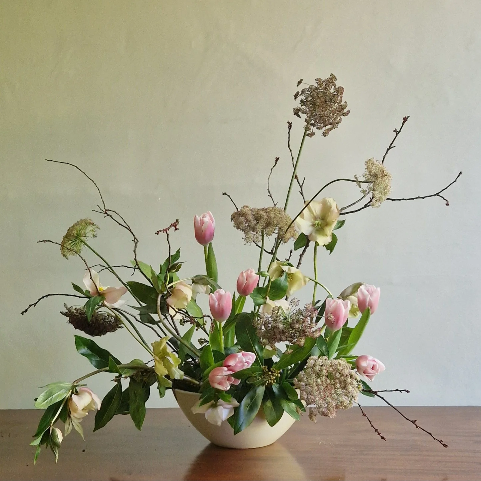 sculptural spring flower arrangement, tulips and hellebores