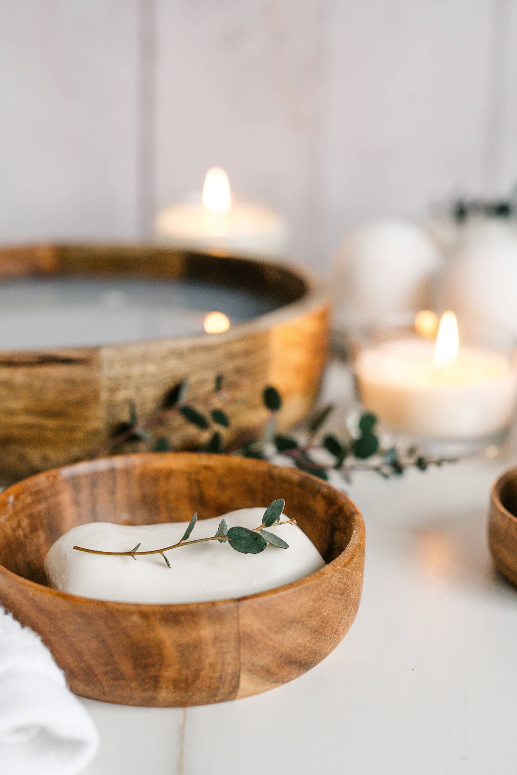 Wooden bowl with massage lotion for massage therapy in RVA