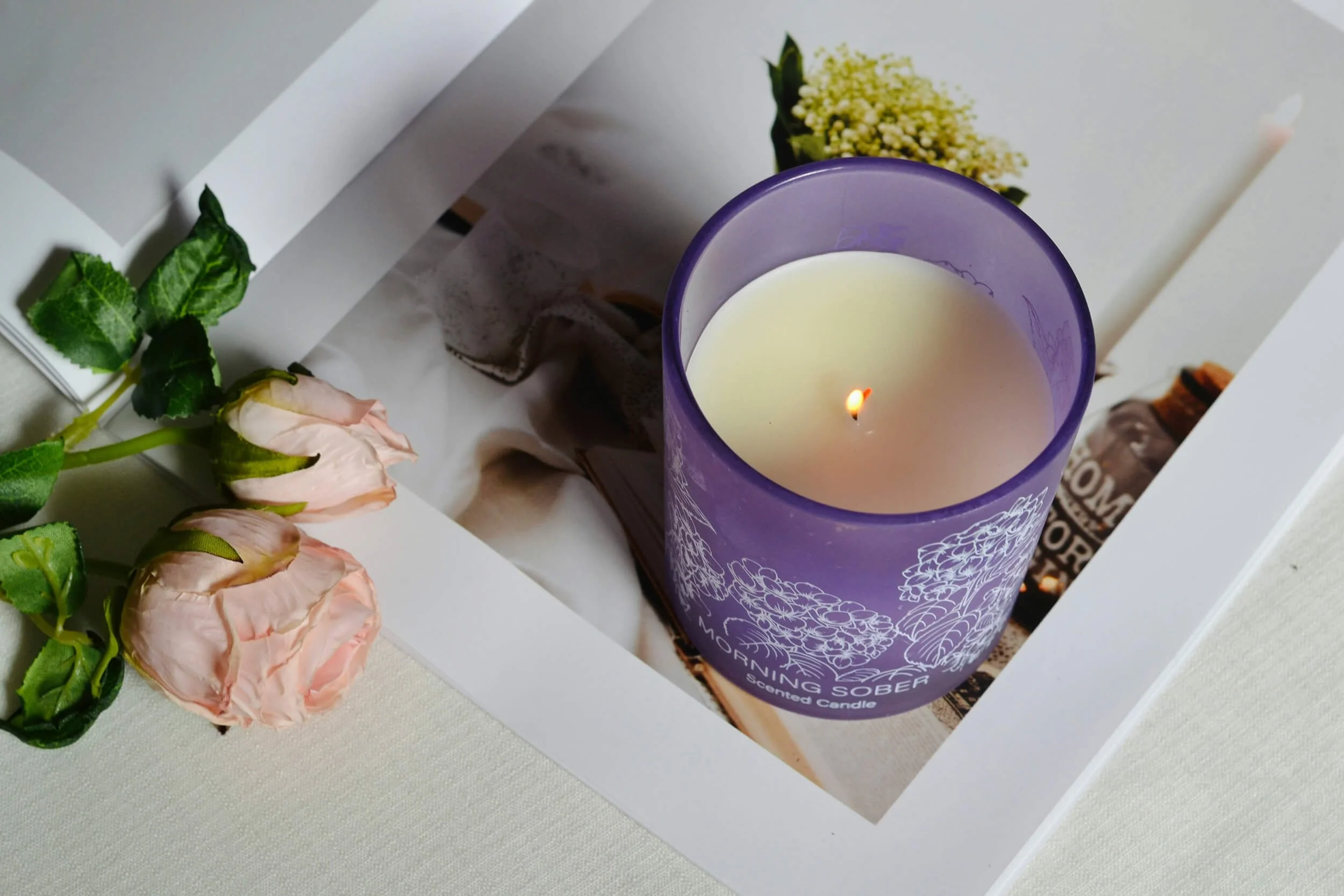 A purple scented candle representing massage therapy in Chesterfield, VA.