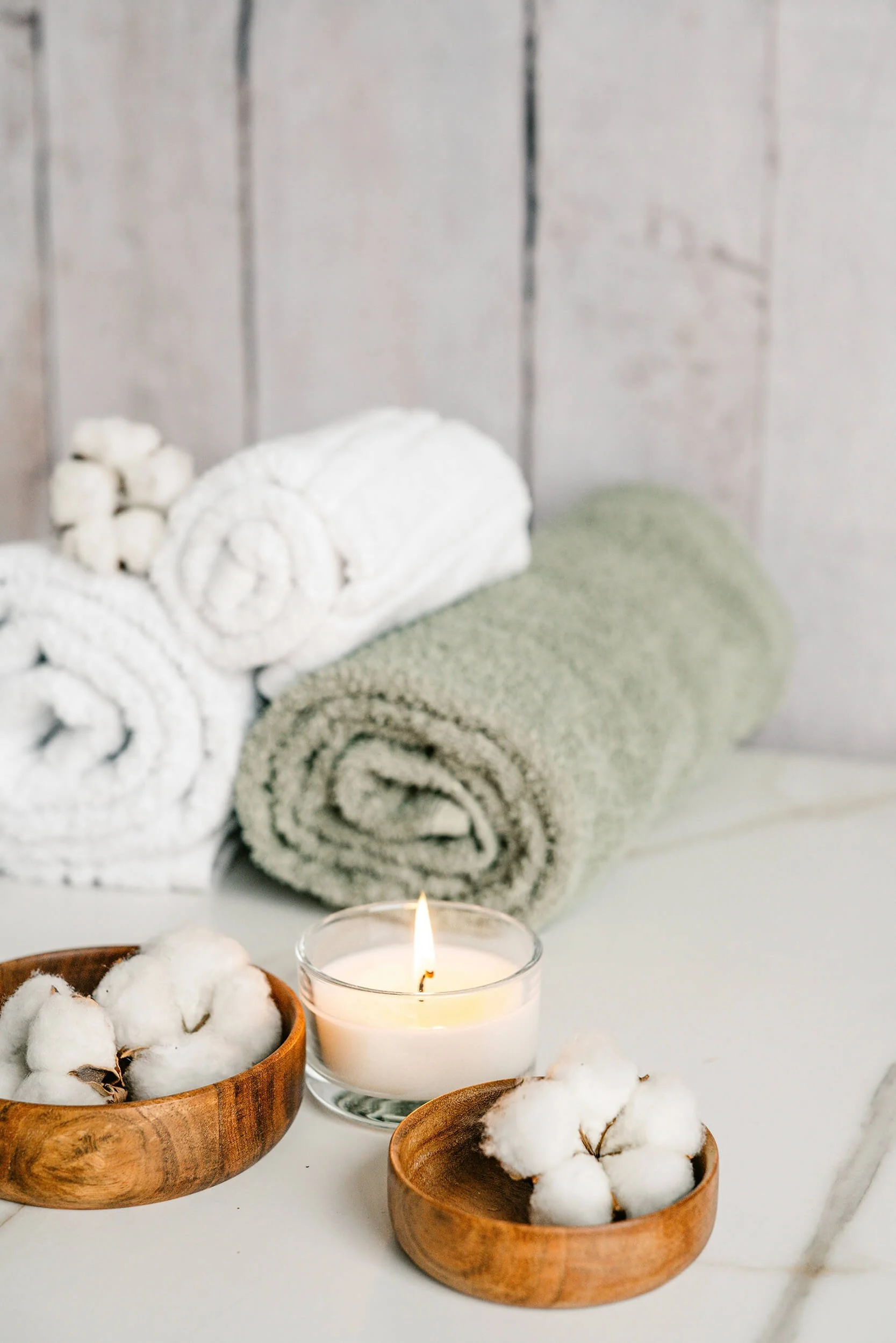 Towels and candles used in Tripp Within massage space in Chesterfield, VA
