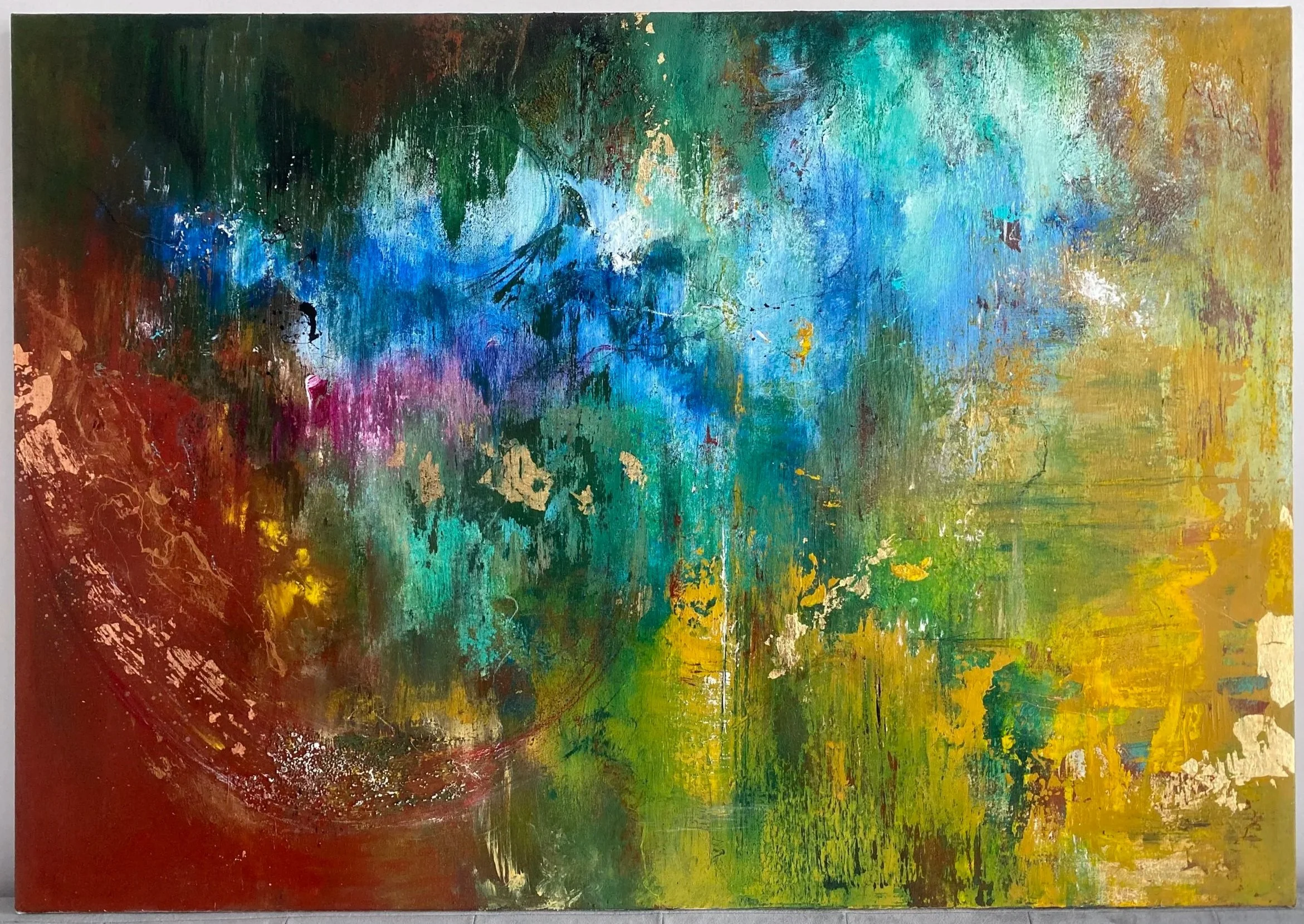 Abstract painting with vibrant splashes of blue, green, yellow, red, purple, and black, featuring textured and layered brushstrokes.