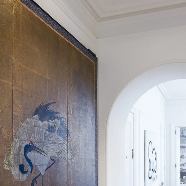 The elegance of a simple arched opening and salvaged marble fireplace. In this apartment the character of the existing architecture is complimented by the client&rsquo;s art and objects. Thoughtful restraint, considered interventions, rich textures, 