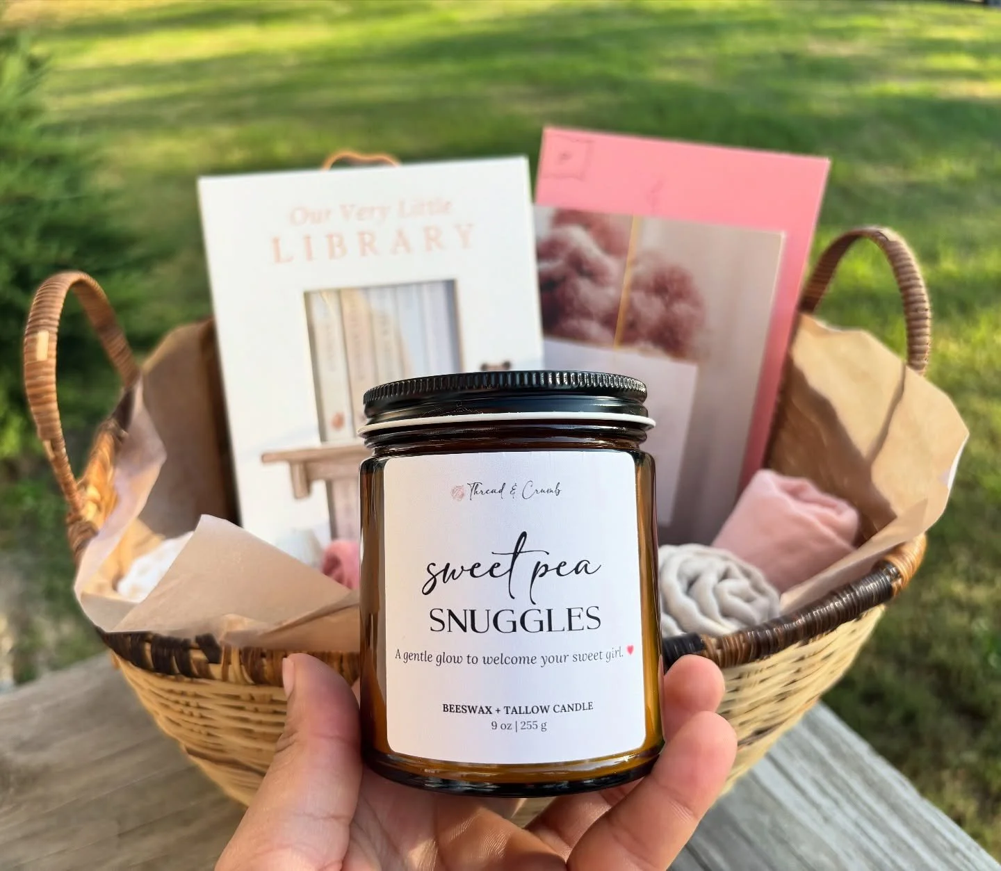 Baby showers are some of our favorite events to create for! 🍼🎀

This basket features a candle in the scent Sweet Pea Snuggles&mdash;one of our most requested scents for new arrivals. If you&rsquo;re planning a shower or want your guests to take hom