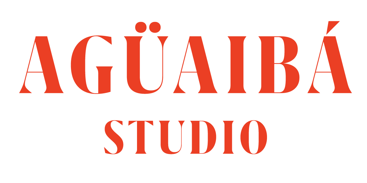 A logo for Agüaba Studio with the name in bold orange-red letters on a black background.