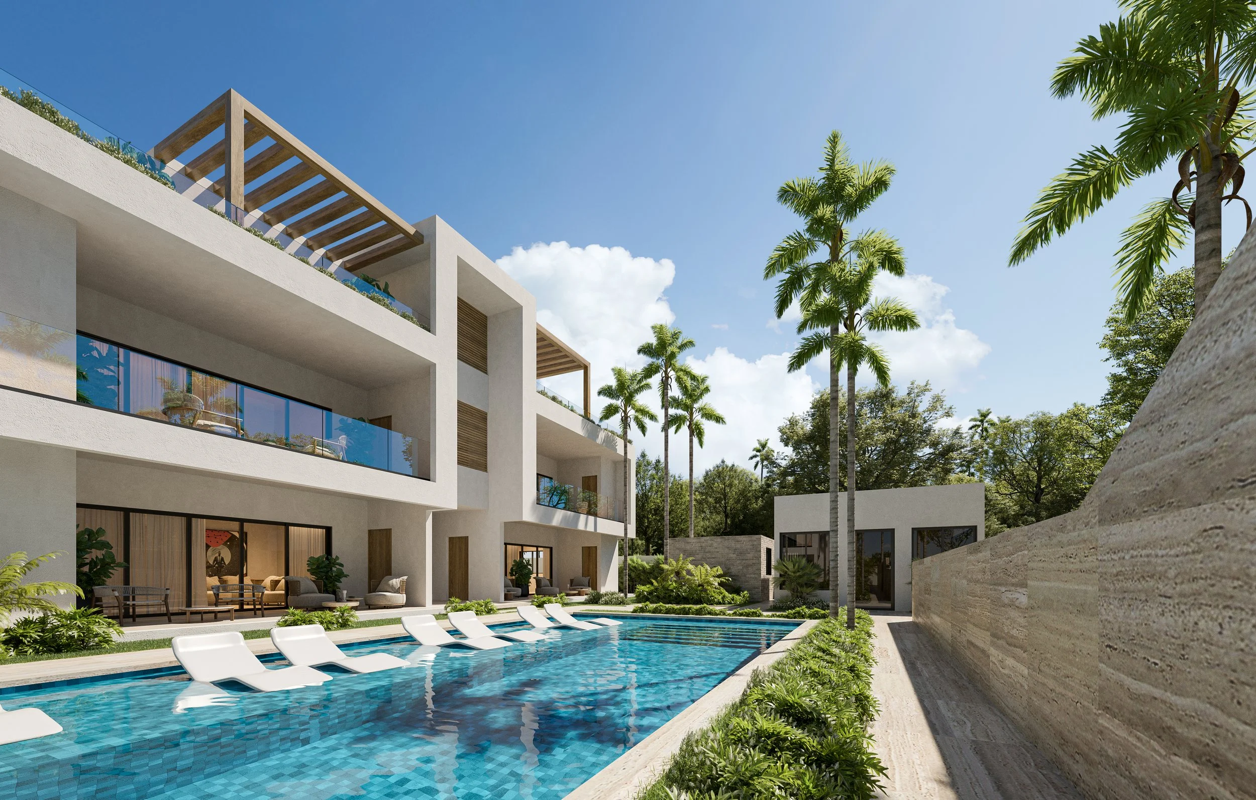 Luxury modern apartment complex with a swimming pool, lounge chairs, and lush greenery in a tropical setting under a blue sky.