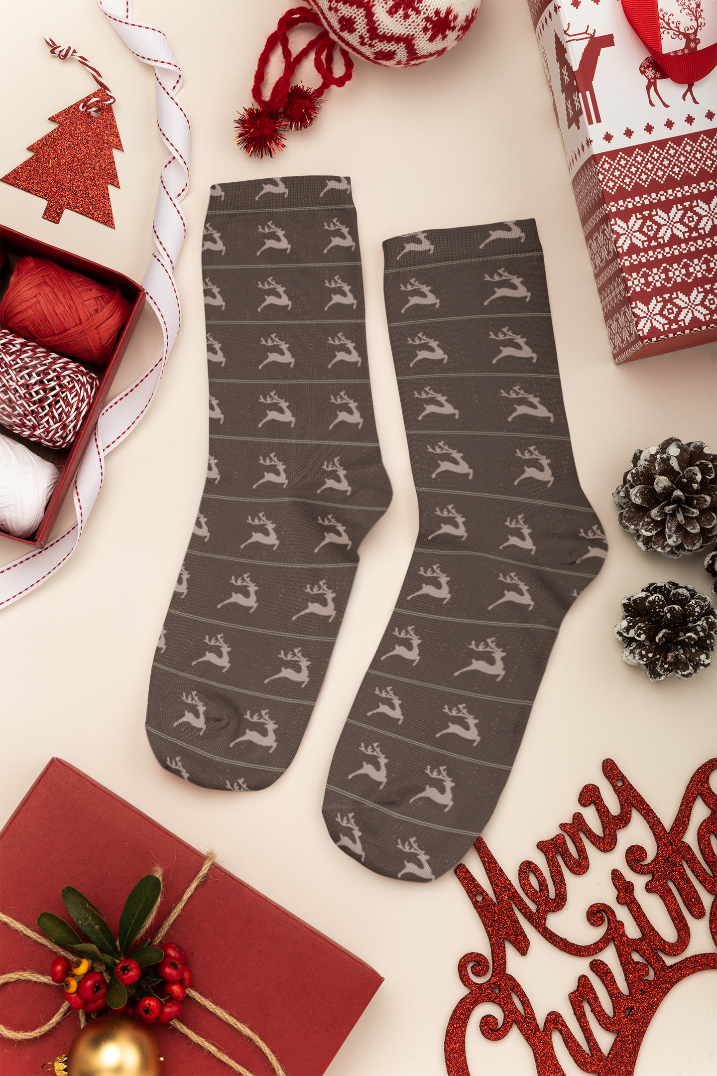 mockup-of-a-pair-of-socks-lying-on-a-christmas-decorated-surface-30640.png