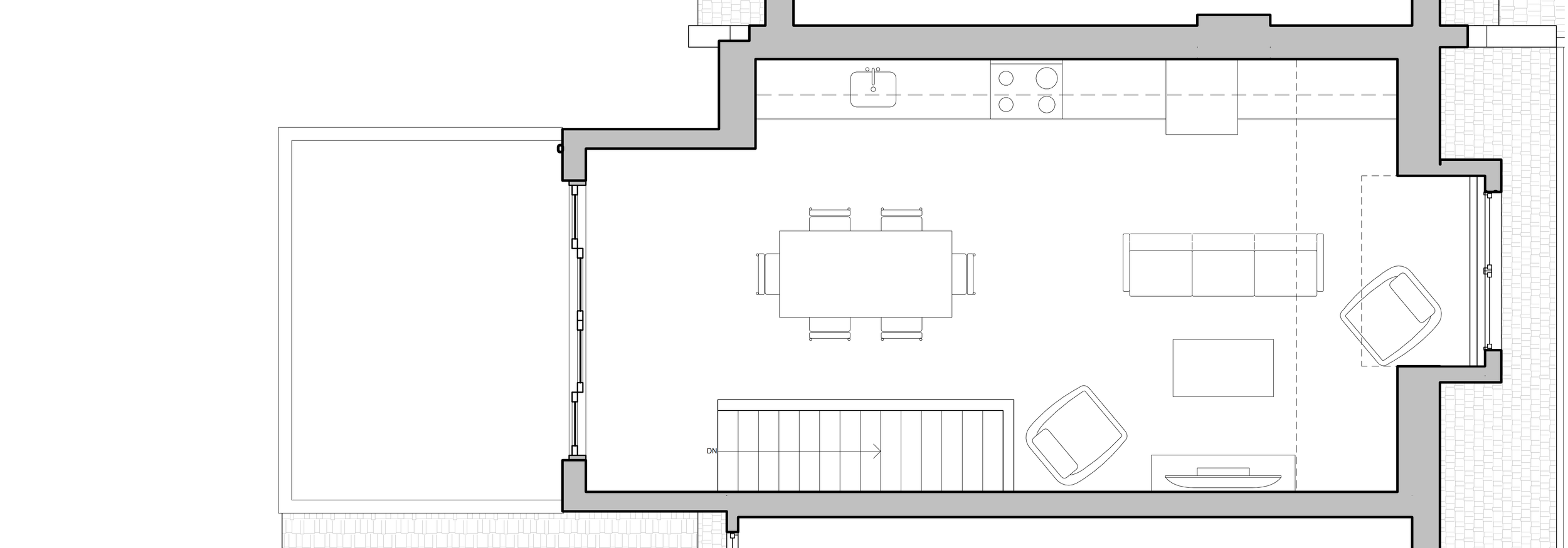 Floor plan of a living space with a kitchen, dining area, and living room, including kitchen appliances, a dining table with chairs, a sofa, chairs, and a TV, with outside terrace area.