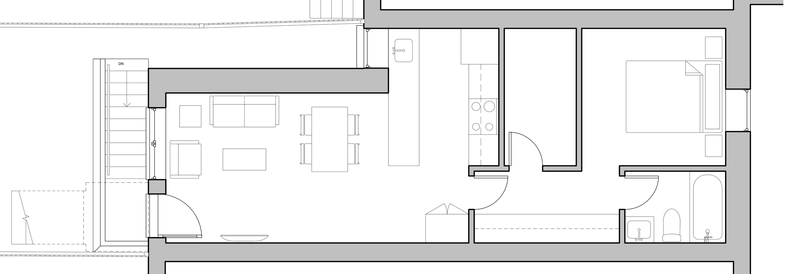 Floor plan of a house interior showing a living area with sofas and a dining table, a kitchen with an island, a bedroom, and a bathroom with a bathtub and toilet.