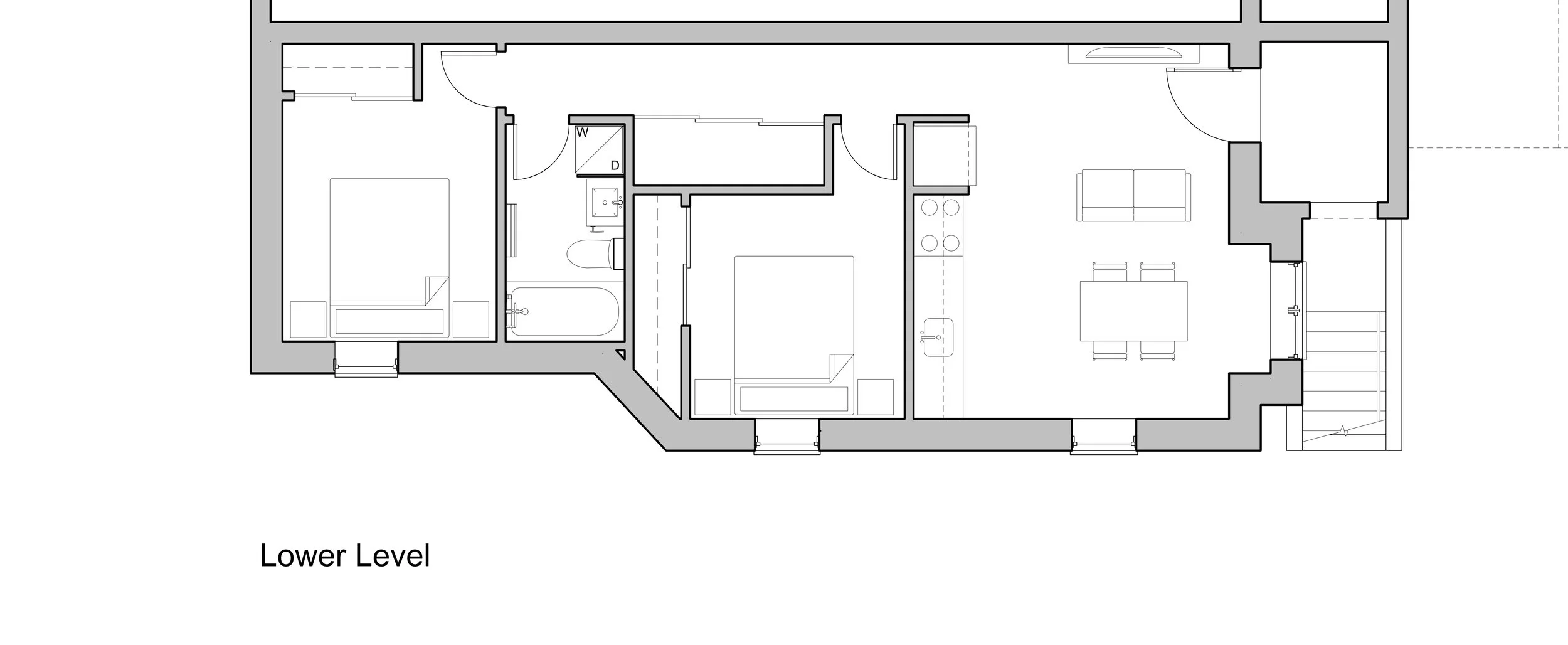 Floor plan of a lower level residential space with two bedrooms, a bathroom, a utility area, and an open-concept living and dining area.