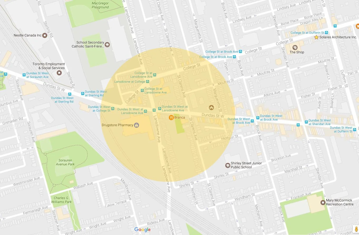 Map of a neighborhood highlighting the area around Dundas Street West with parks, schools, and public transportation stations marked.
