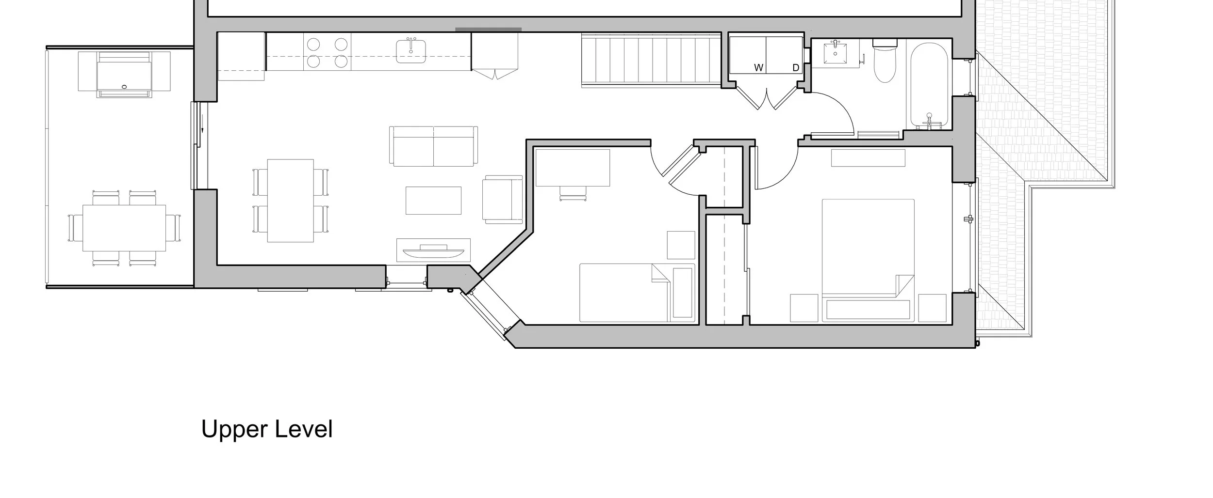 Floor plan of the upper level of a house, showing a living room, dining area, kitchen, two bedrooms, a bathroom, laundry area, and outdoor terrace.