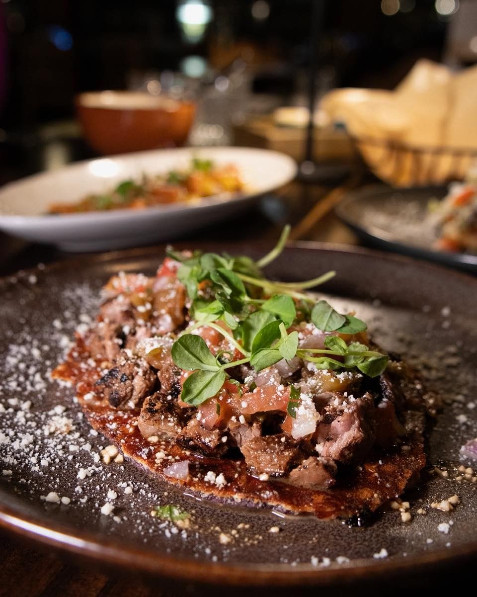 Huaraches, one of Mexico&rsquo;s most beloved street foods, done the Xico way. 🔥

Housemade masa, hand-shaped in the traditional sandal form, layered with refried pinto beans, grilled marinated skirt steak, chiles toreados, caramelized onions, Mexic