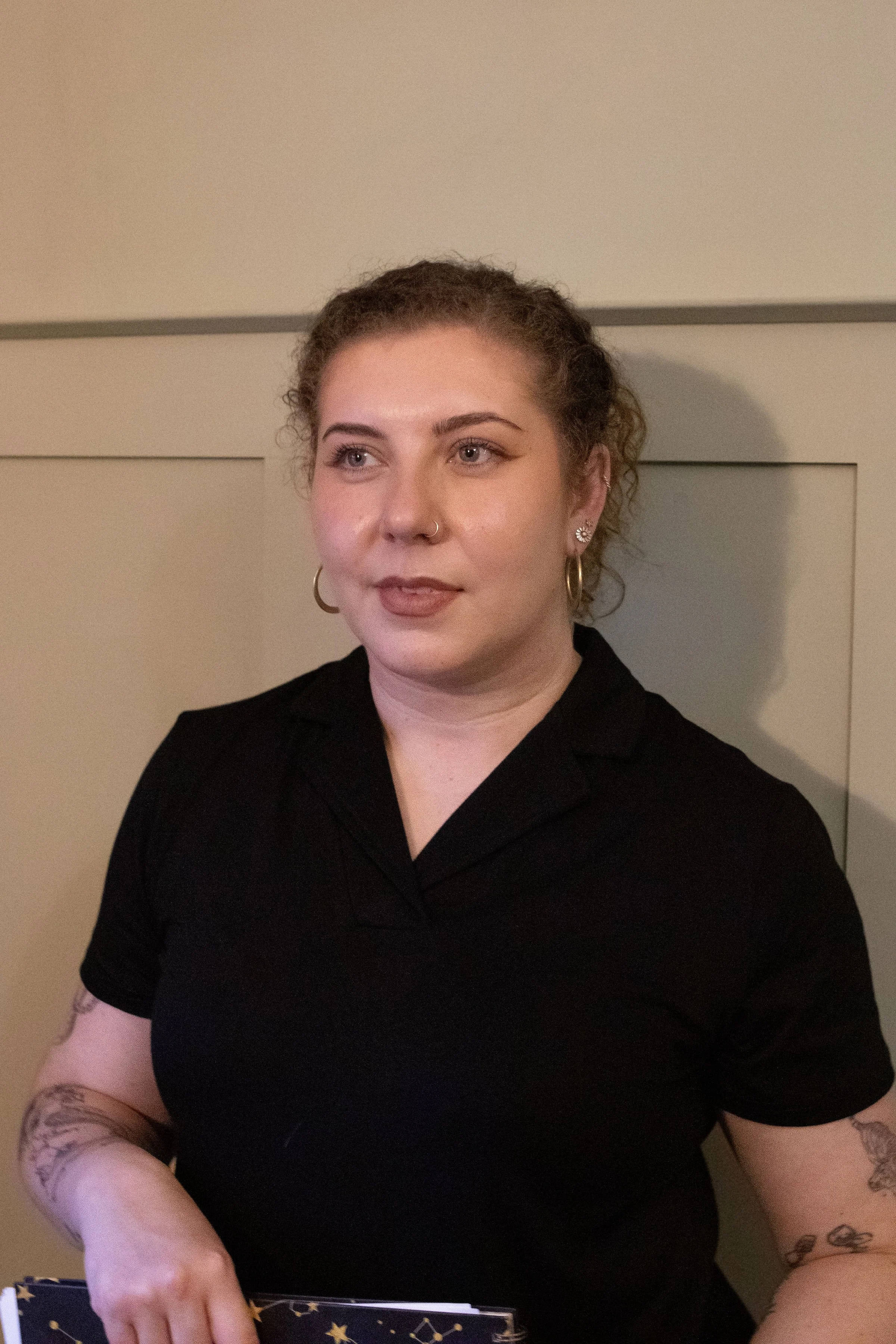 portrait photo of a friendly female massage therapist