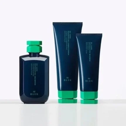 One bottle and two tubes of R+Co/Blue hair care product photos