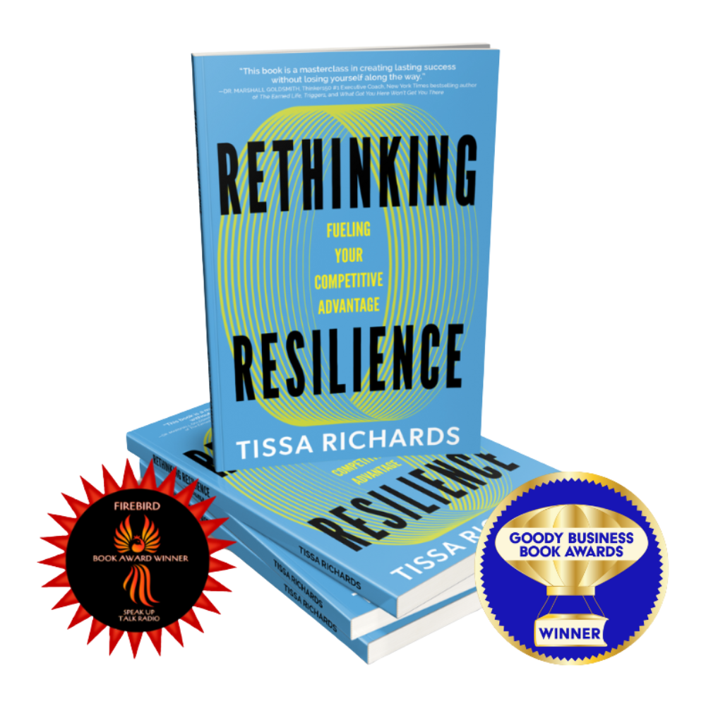 A copy of the book "Rethinking Resilience: Fueling Your Competitive Advantage" by Tissa Richards, displayed upright with additional copies stacked beneath. The cover is blue with yellow and black text, and has a circular design in the background. There are two award badges in the image: a red badge from Firebird Book Awards and a blue and gold badge from Goody Business Book Awards, indicating the book's achievements.