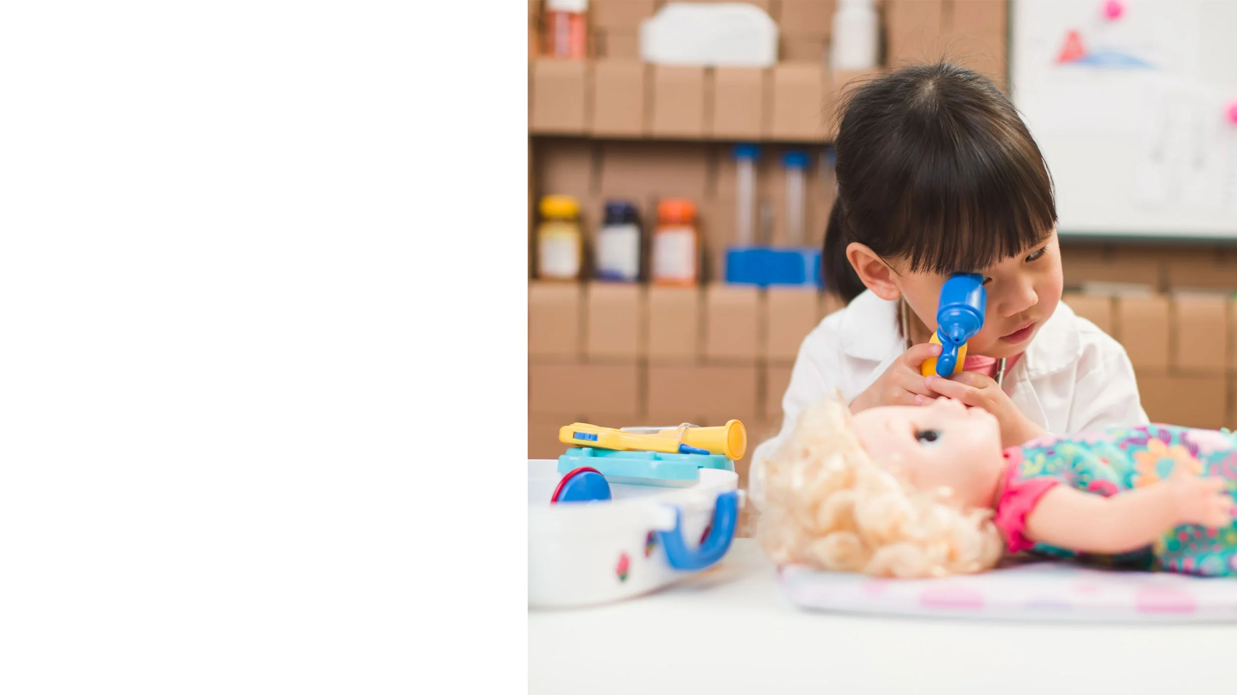 A young girl at a medical clinic having her heartbeat checked by a nurse using a stethoscope.