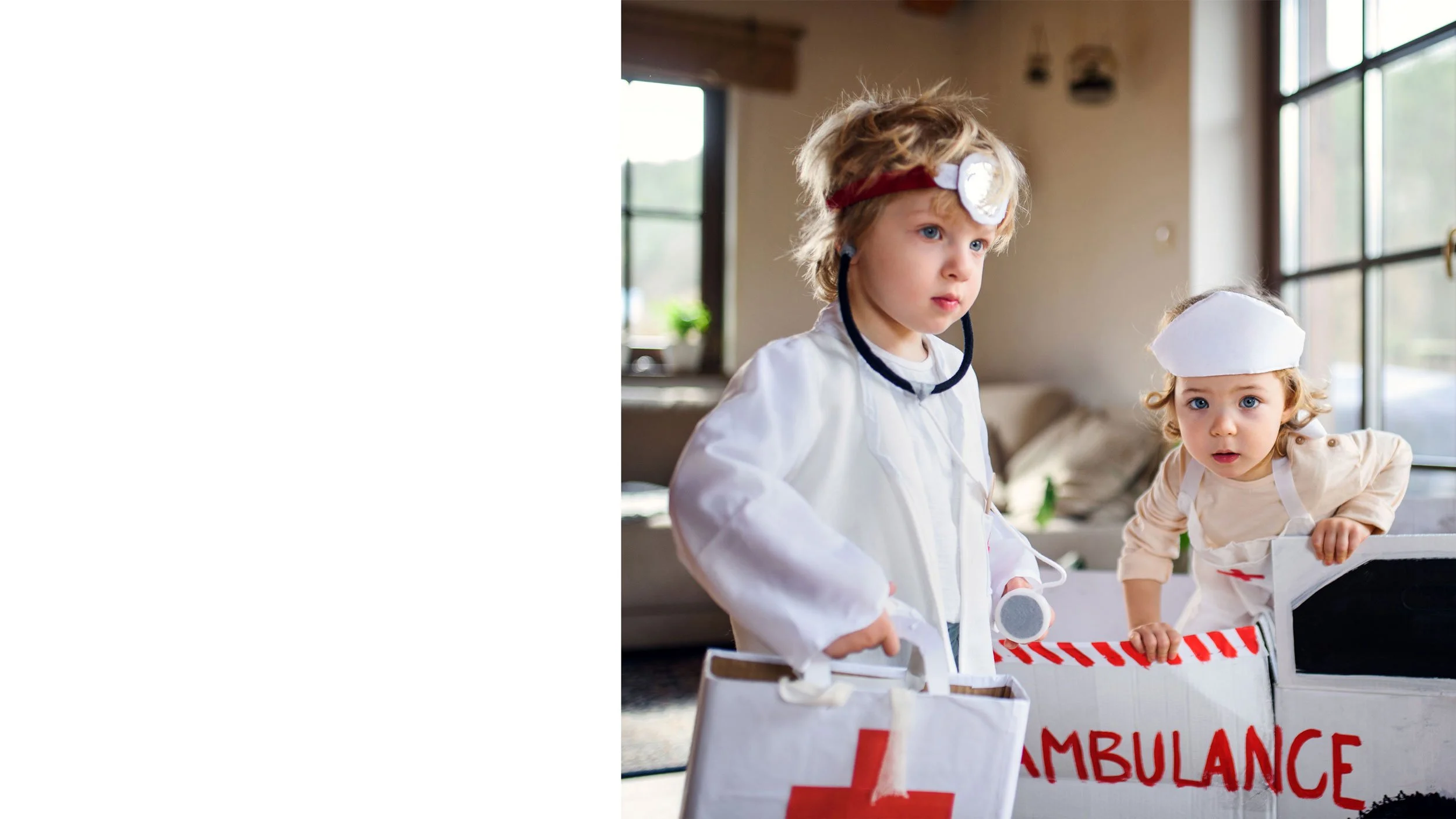 Close-up of an adult holding a baby's tiny hand, with the baby wearing a striped onesie.