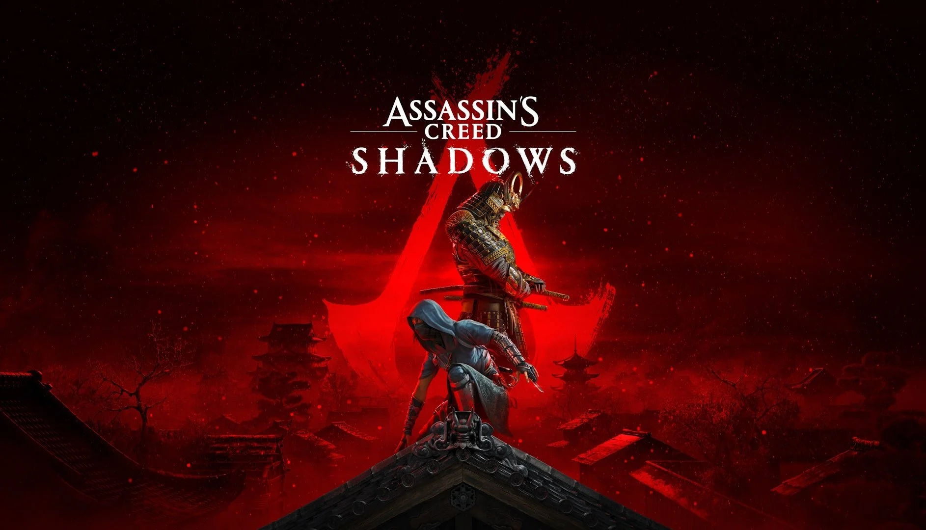 Portada del videojuego Assassin's Creed Shadows con dos personajes dressed en armaduras y ropa tradicional japonesa, de pie en un tejado con fondo de templos y árbol, en un ambiente rojo y oscuro