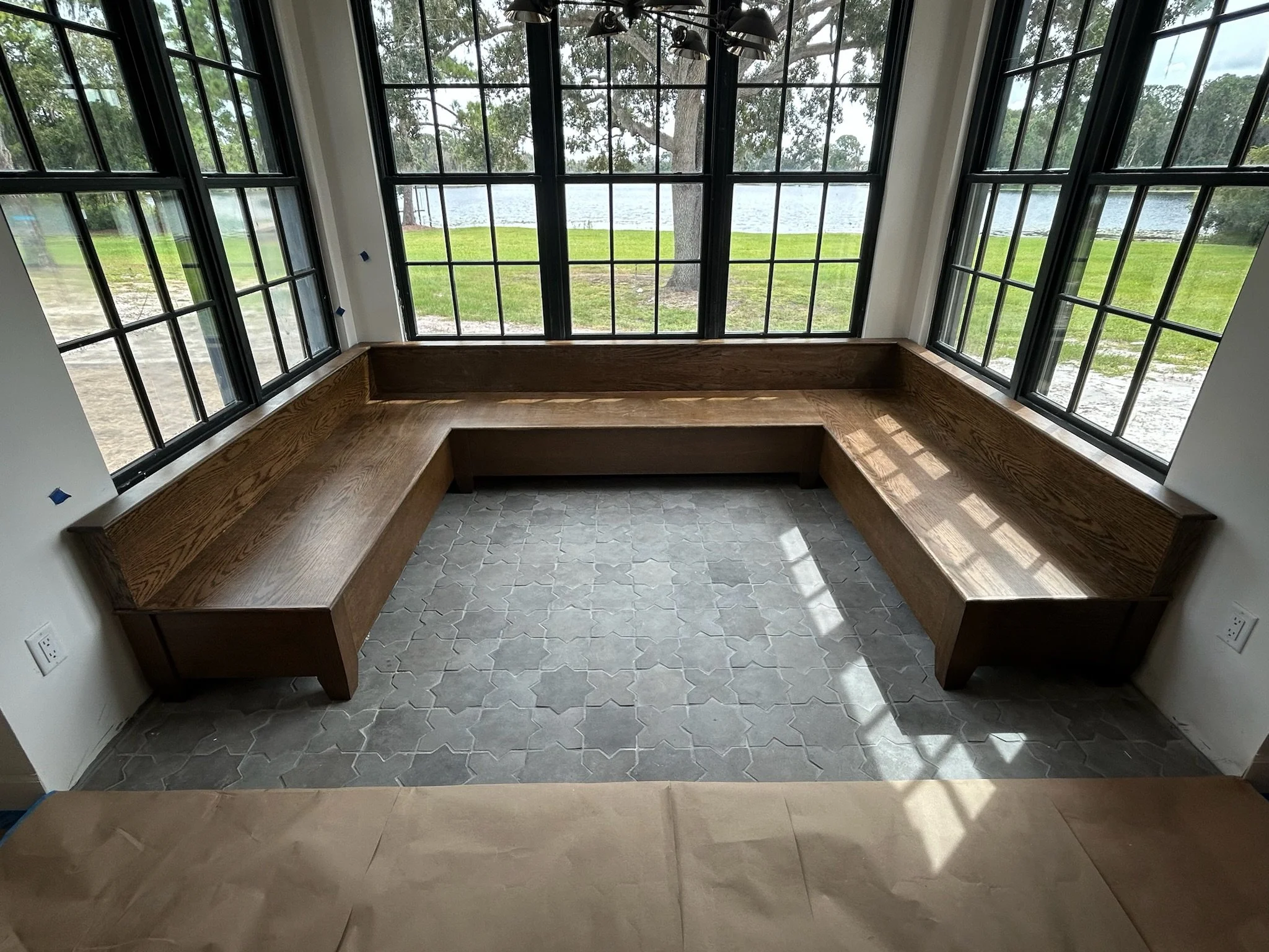 Built-in wood window seat in a kitchen breakfast nook