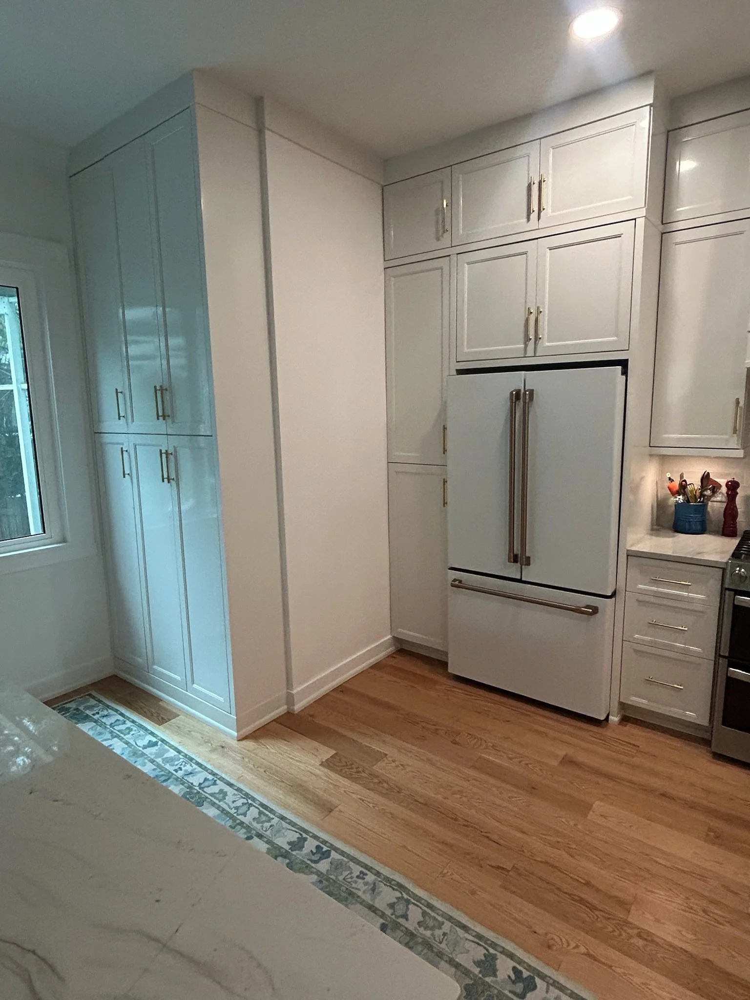 Kitchen with custom cabinets and custom pantry