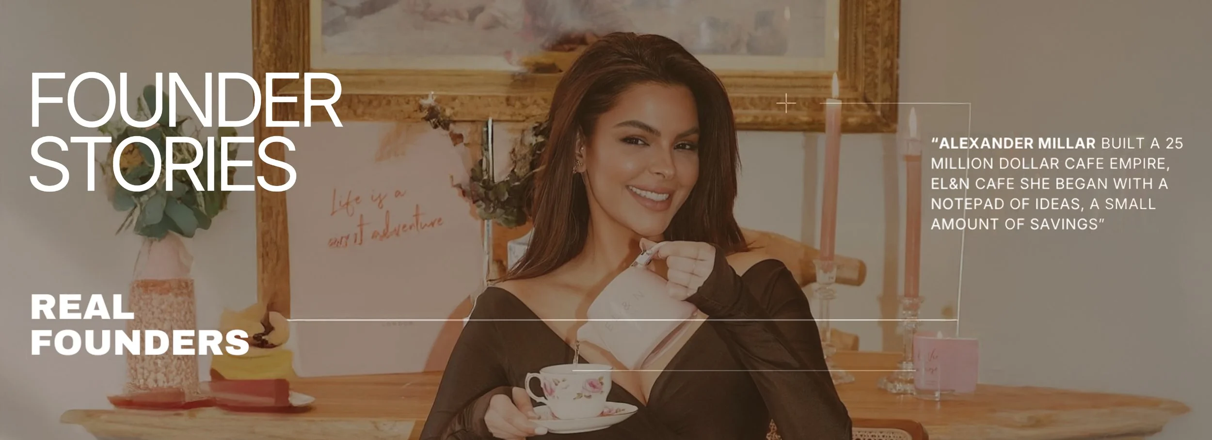 A woman with long brown hair, smiling and holding a teacup, seated in a cozy cafe with candles and a floral arrangement in the background.