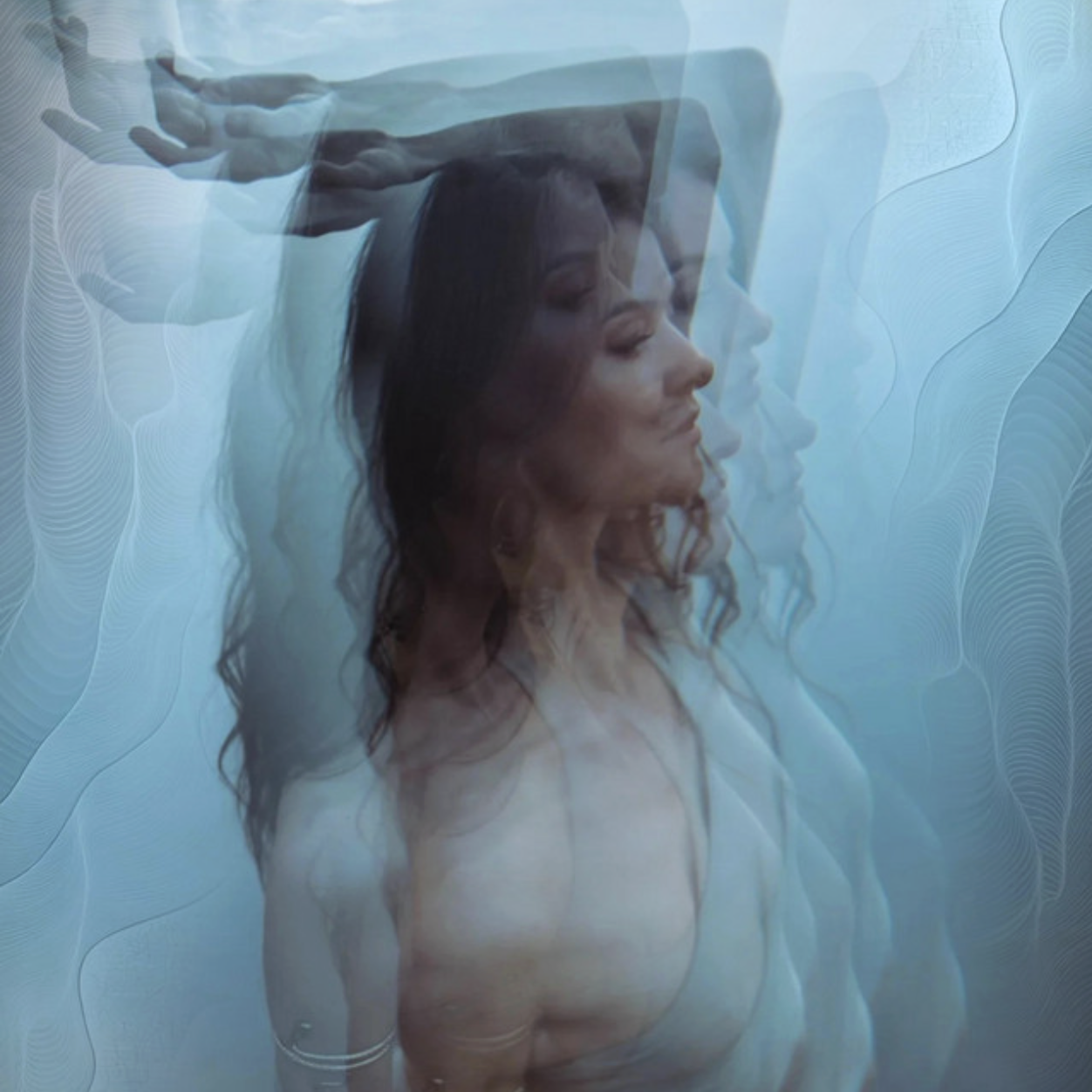 A woman with long dark hair and tattoos on her arm is seen with multiple semi-transparent overlapping profiles of her face and a hand above her head, creating a layered, abstract effect against a textured blue background.