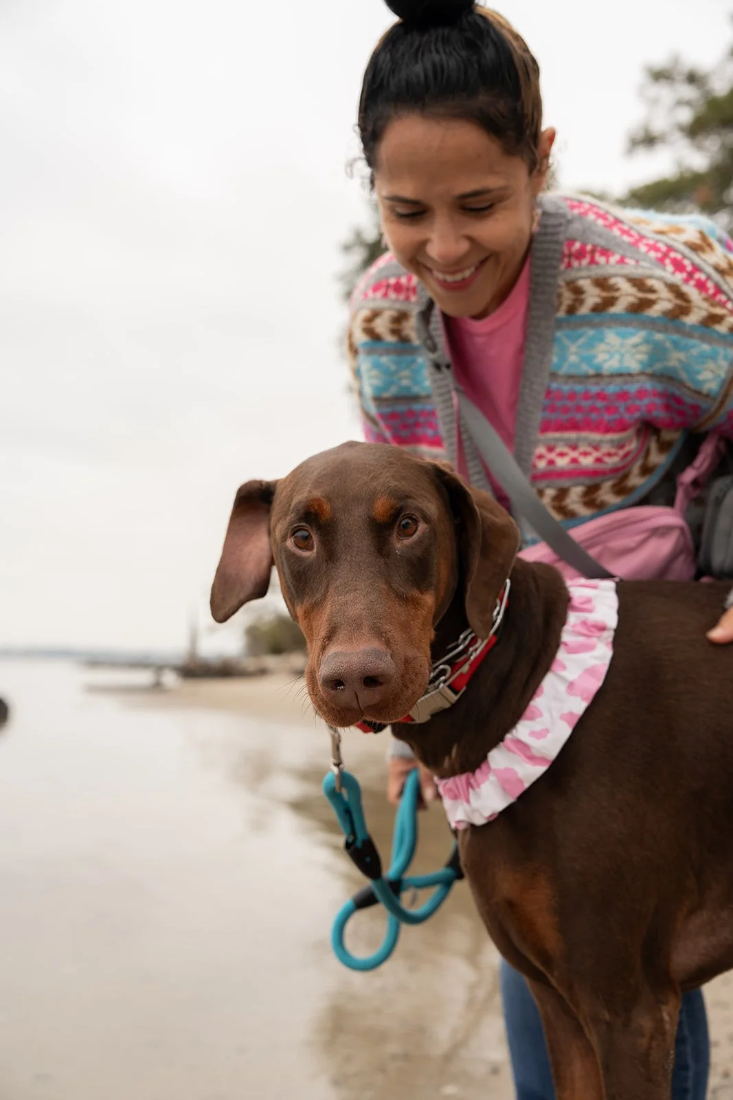Shirley walking doberman at first landing state park beach