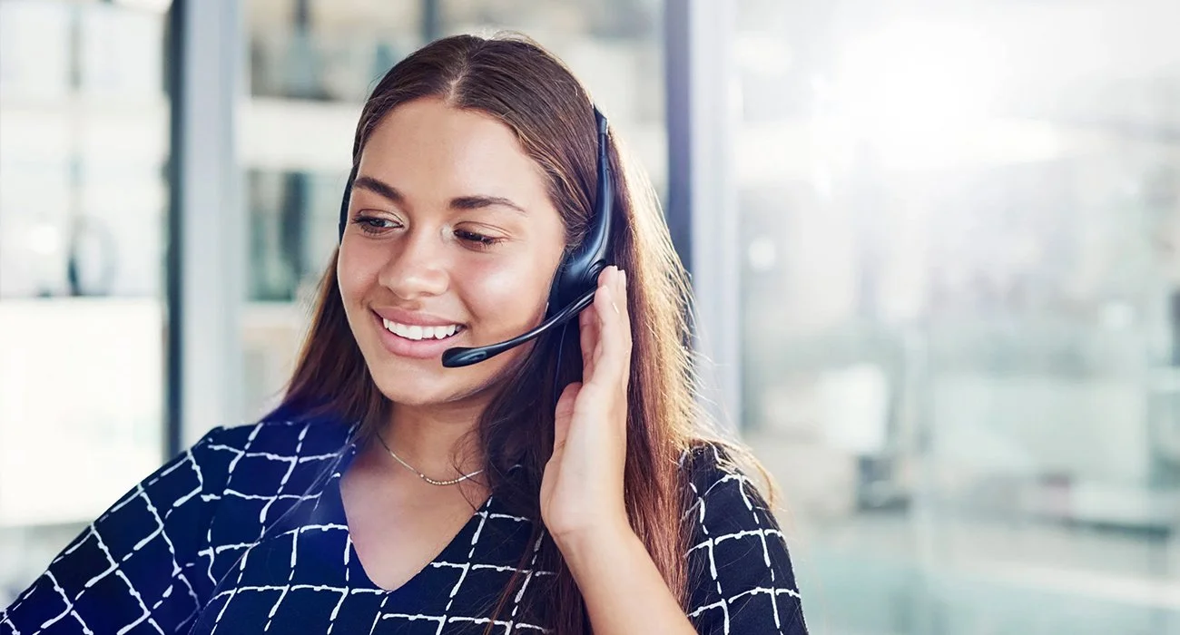 Professional IT support specialist assisting customers, representing a top rated managed IT provider.