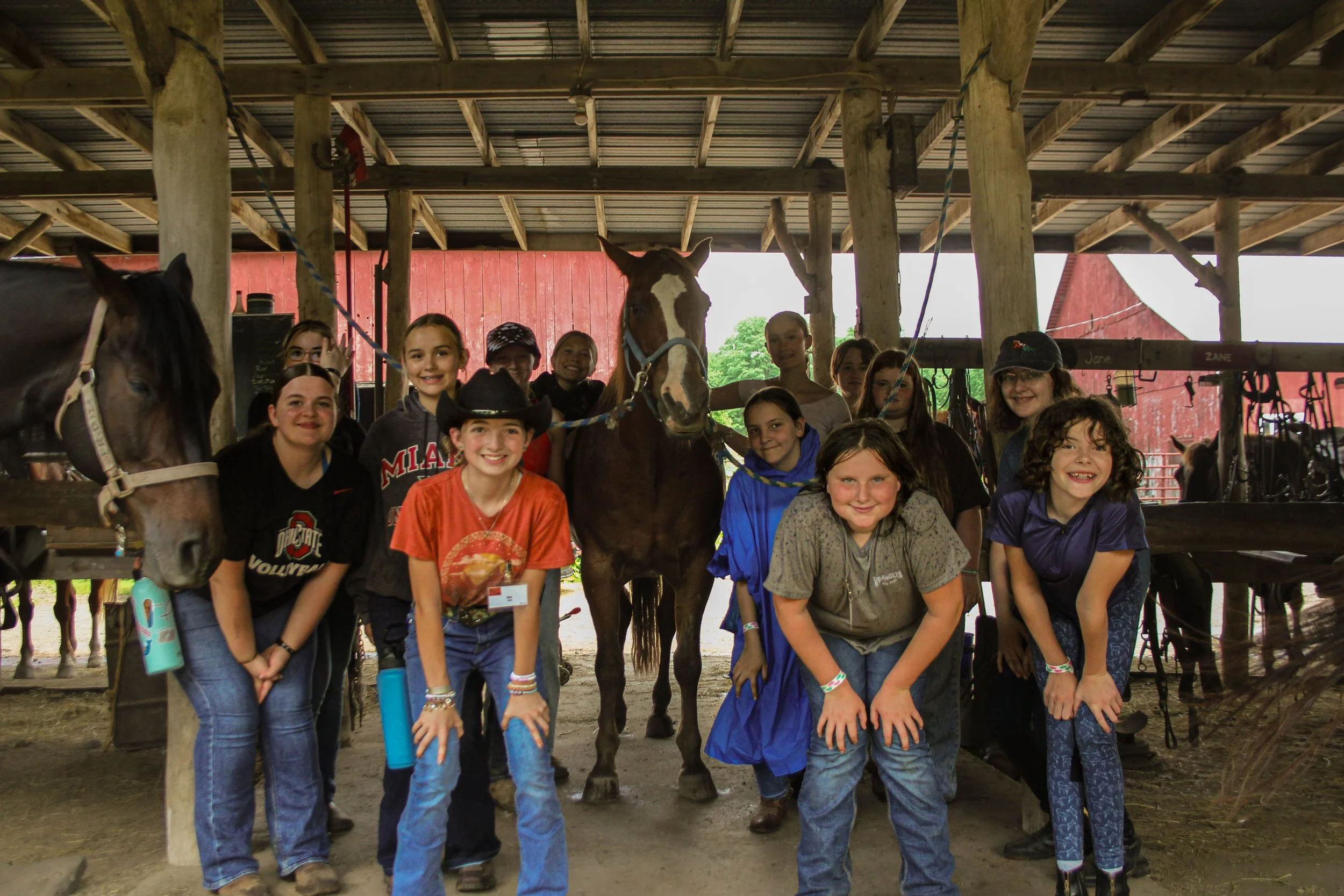girls cabin learning about farrier