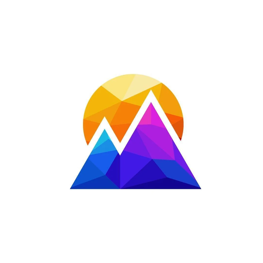 Colorful, geometric mountain range with a setting sun in the background.