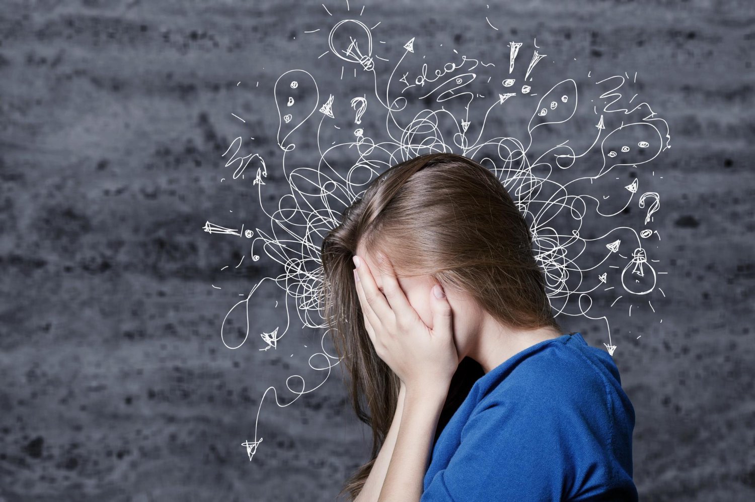 A young woman with long brown hair wearing a blue shirt, holding her head in her hands, with a gray textured background. White doodles of light bulbs, question marks, arrows, and scribbles emerge from her head, symbolizing confusion or overwhelmed thoughts.
