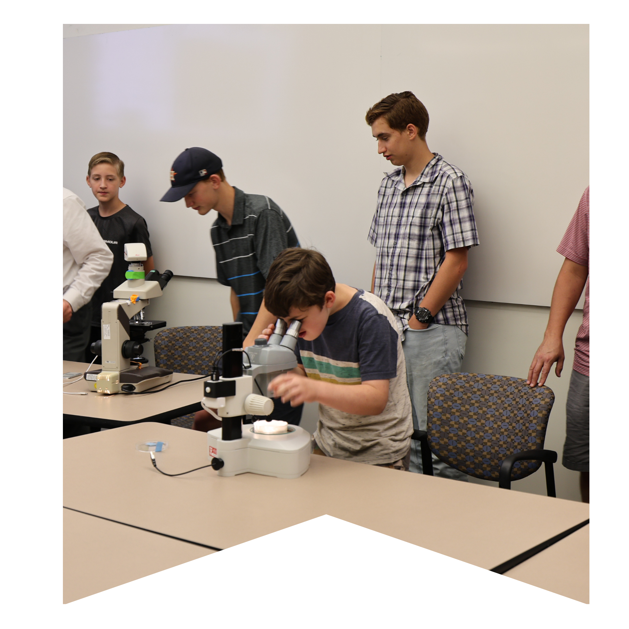 A child looking through a microscope