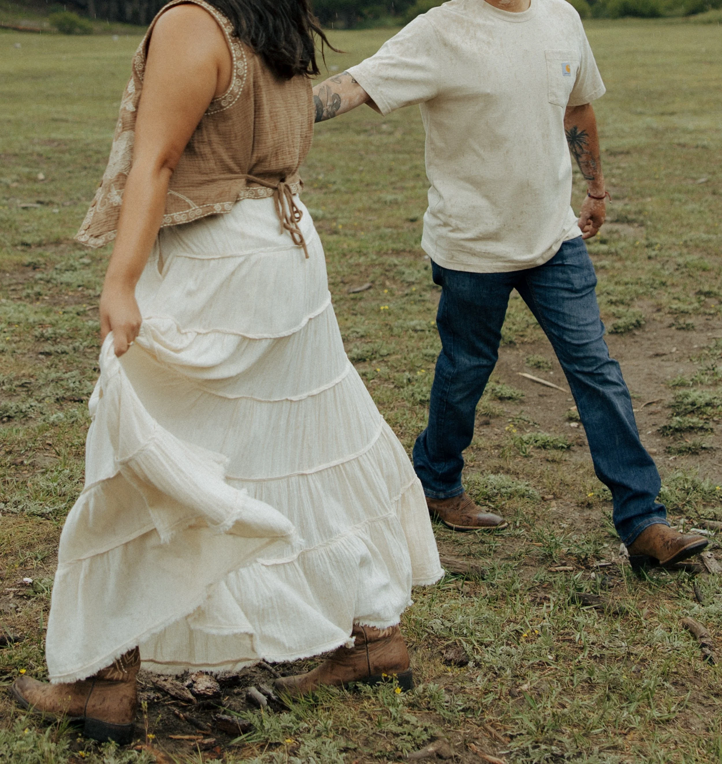 Couple spinning in a circle smiling at each other