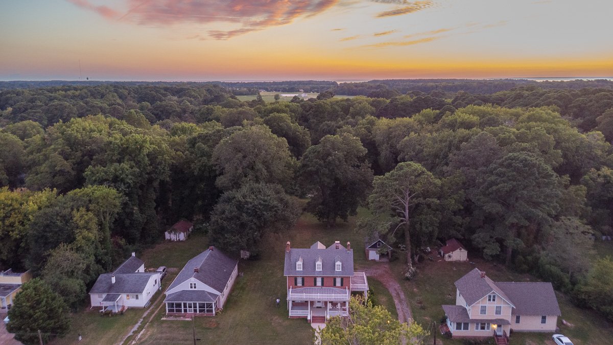 House in center with Chesapeake Bay on the horizon