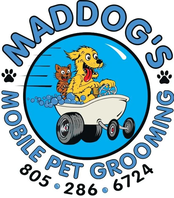 Logo for 'Maddog's Mobile Pet Grooming' featuring a cartoon dog and cat riding in a white bathtub on wheels, with the dog sticking out its tongue. Text encircles the image, including the name, services, and contact number.