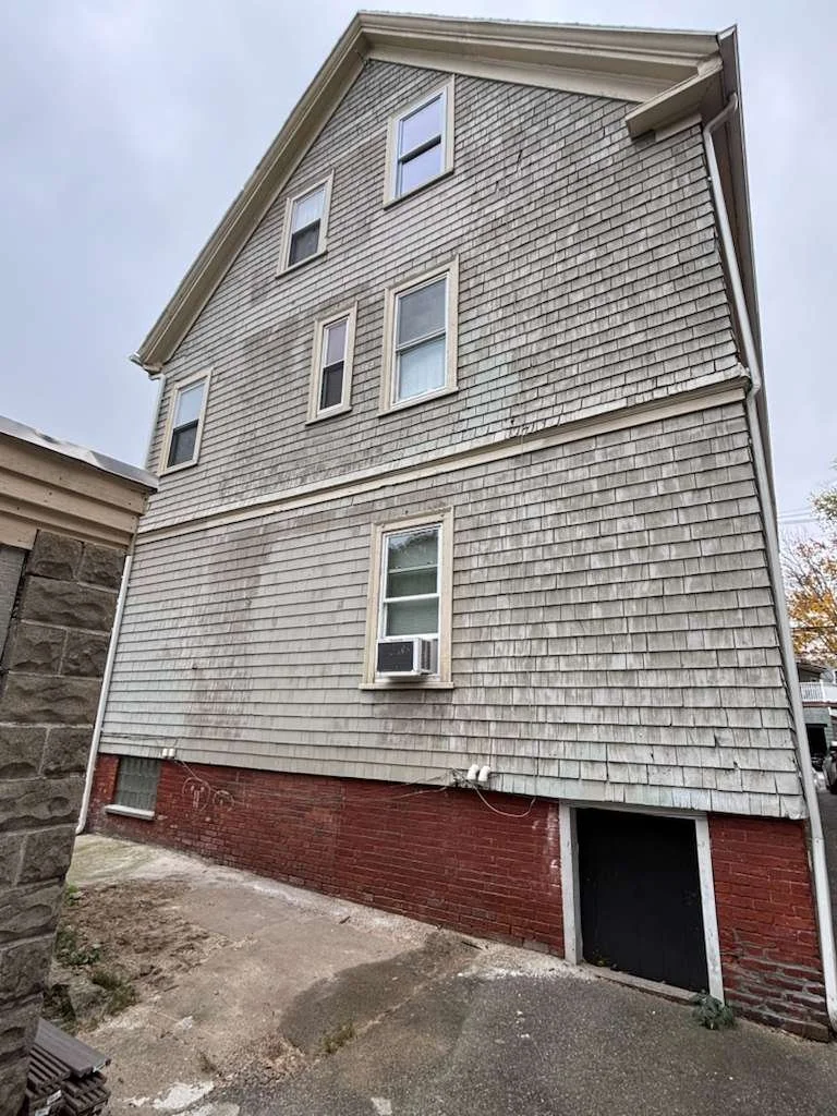 Sealed and patched rear exterior after porch removal