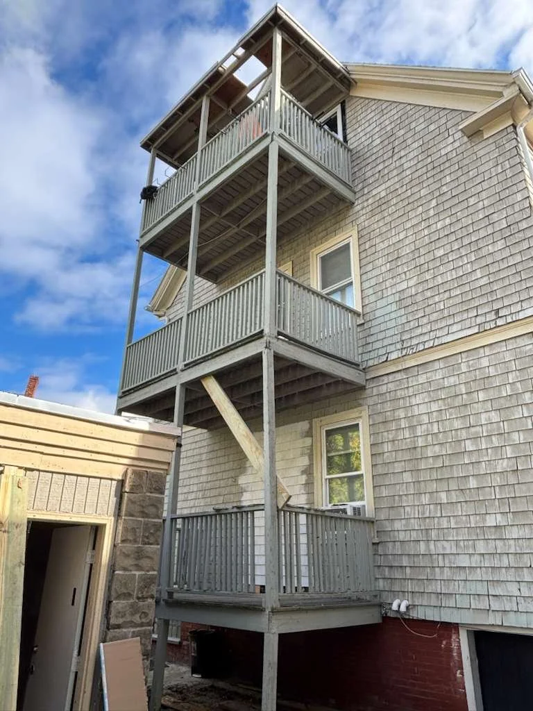 Porch demolition in progress at Somerville, MA multifamily home