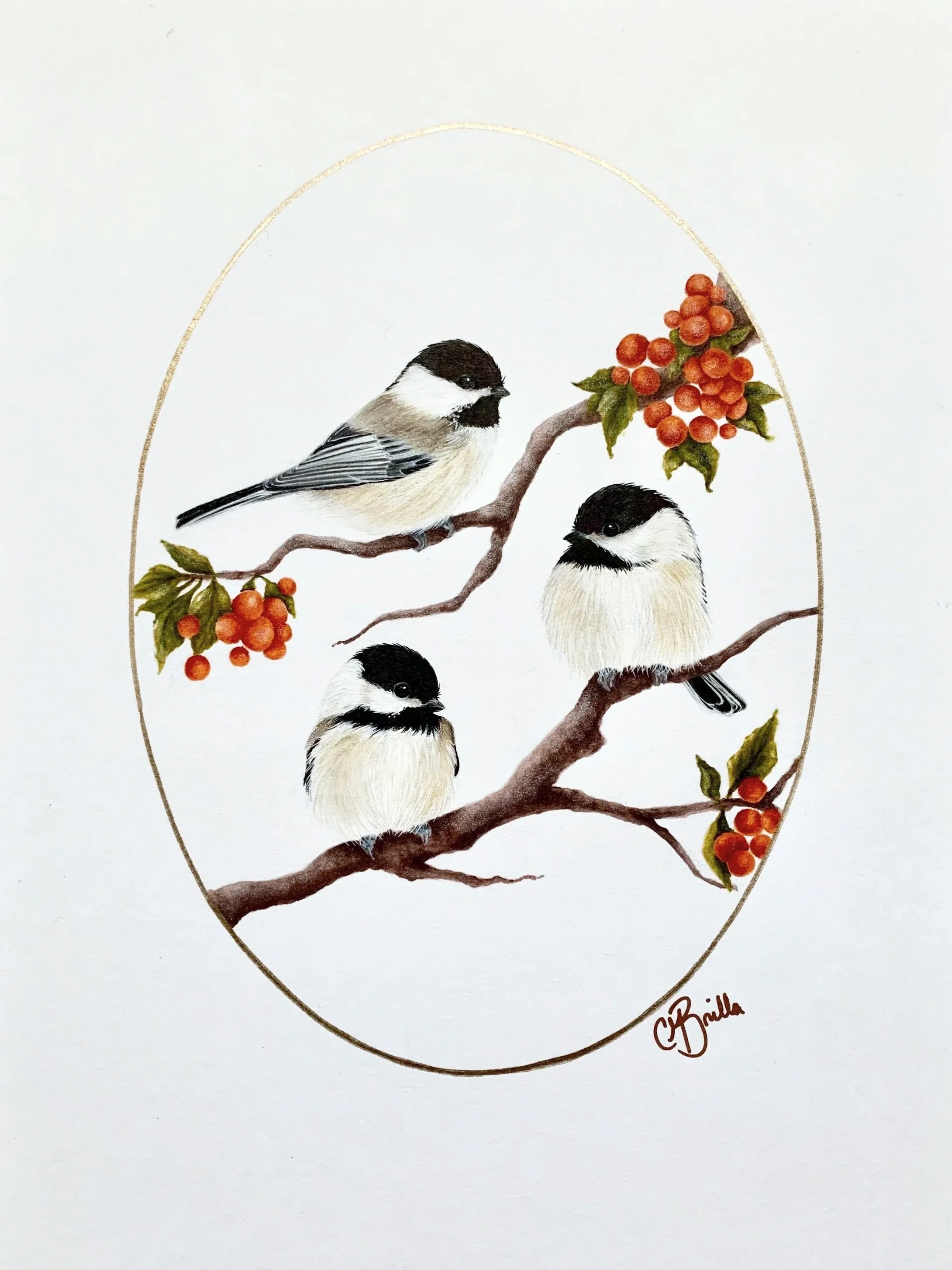 Three small birds perched on a branch with red berries and green leaves, within a gold oval border.