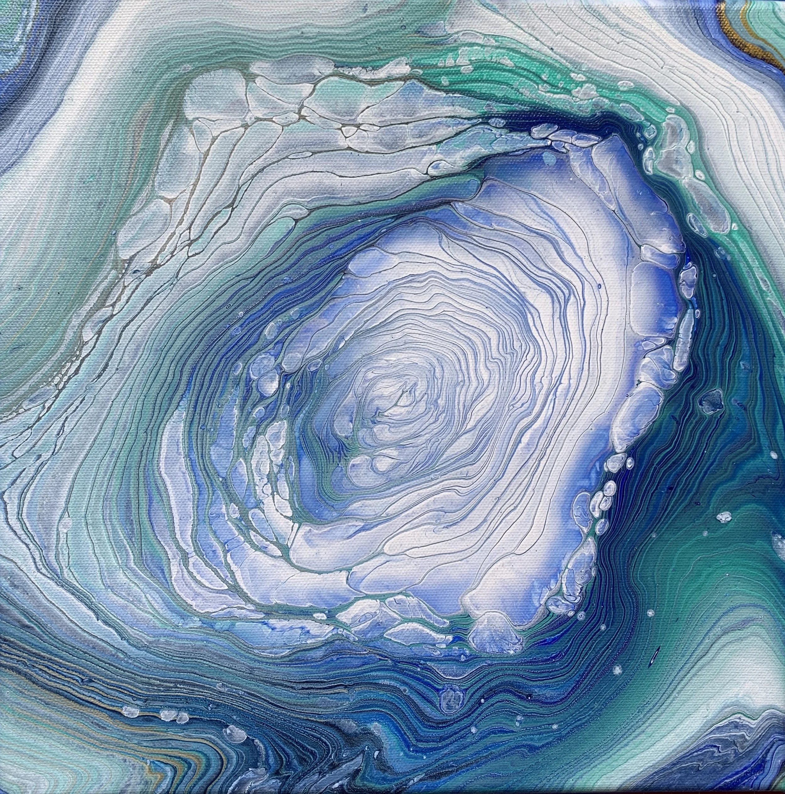 Abstract swirl of blue, green, white, and black paint layered in a circular pattern.
