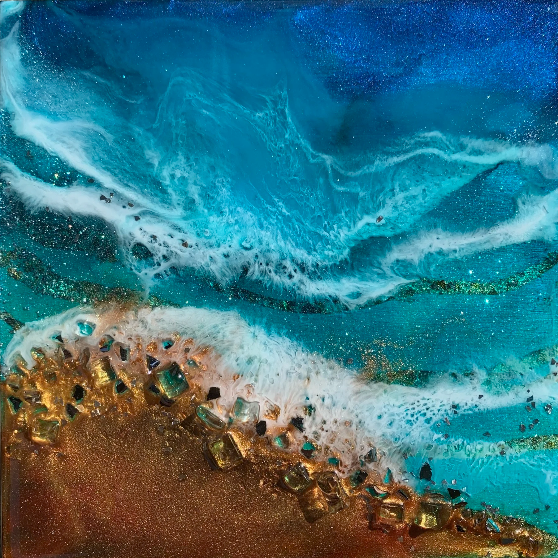 Translucent blue resin waters with golden beach accented with glass stones/available for purchase at Christina Brilla creations