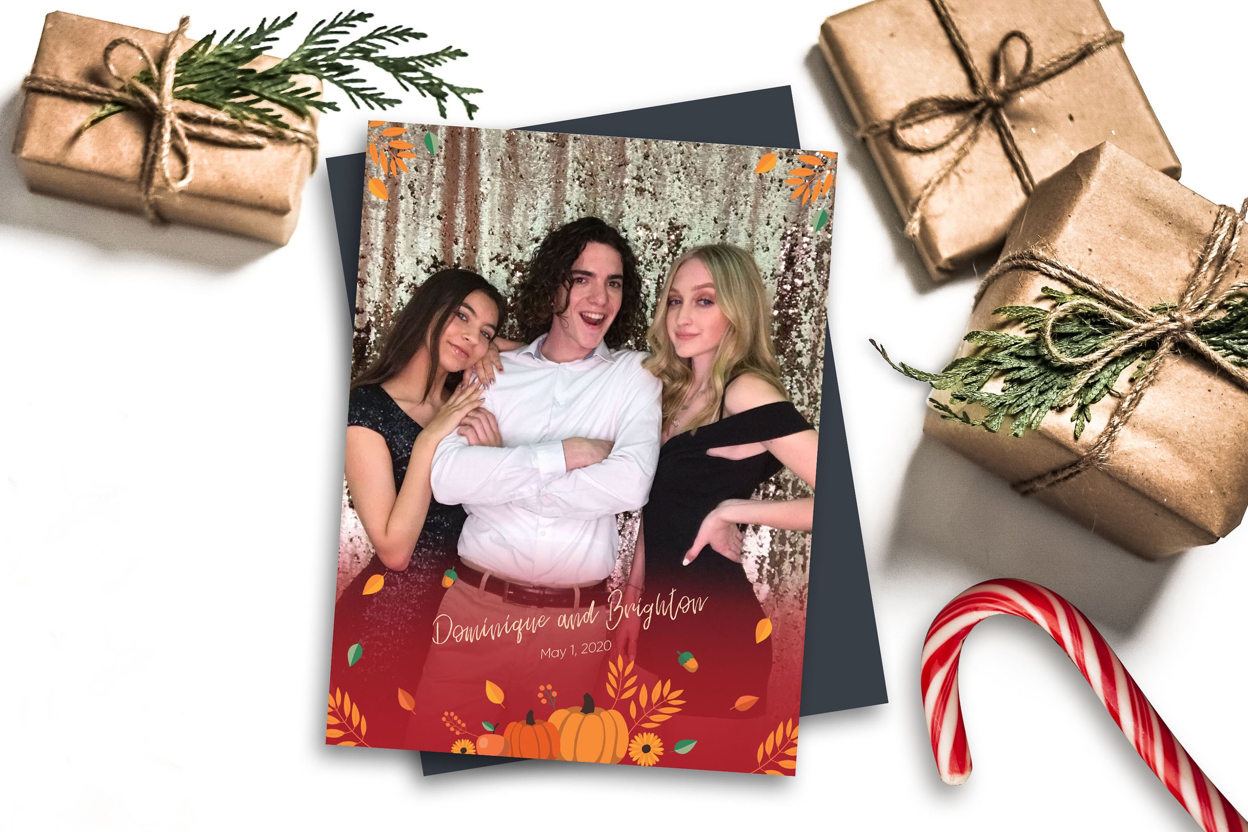 Three people getting photo taken at photo booth.