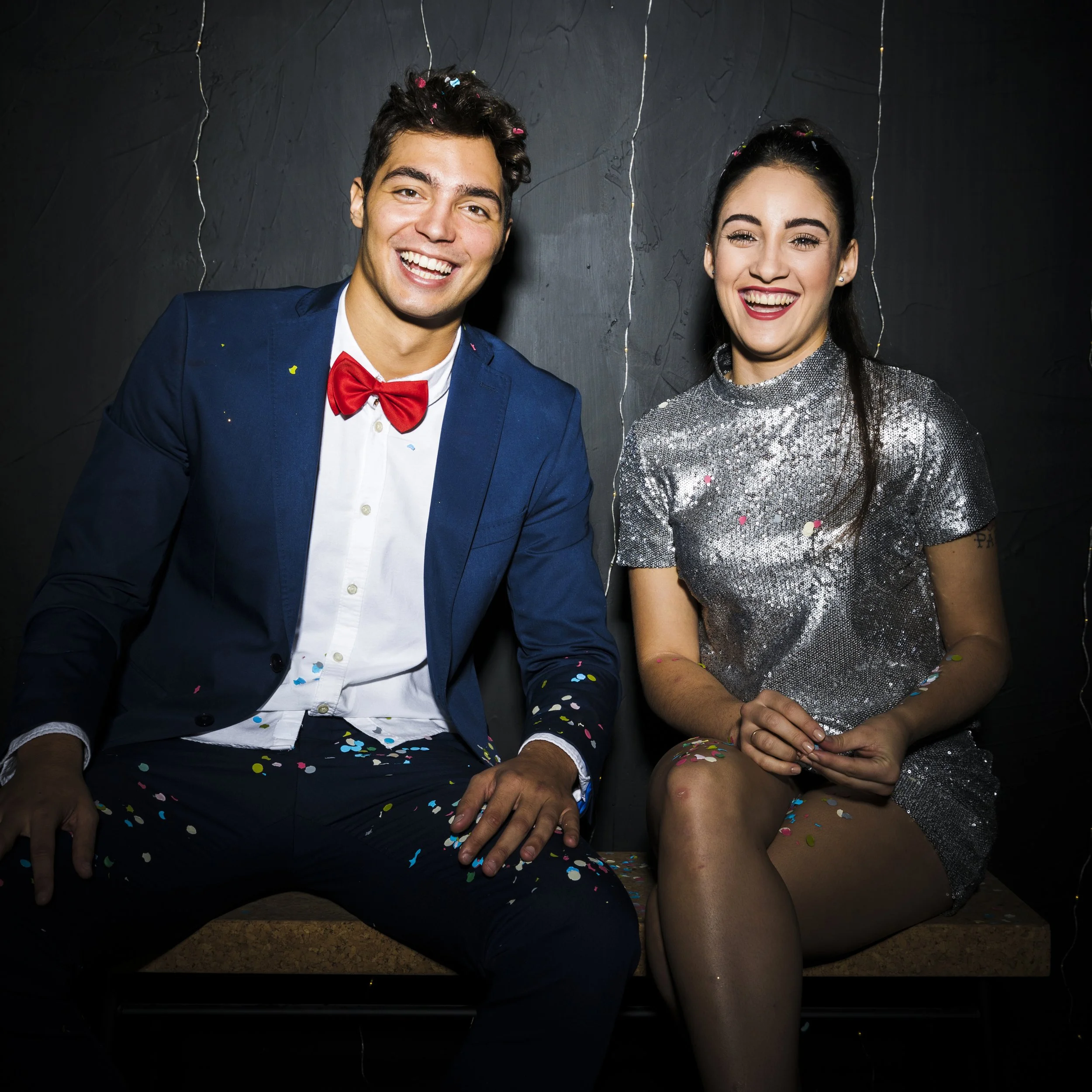 Two happy people getting photos taken at photo booth rental.