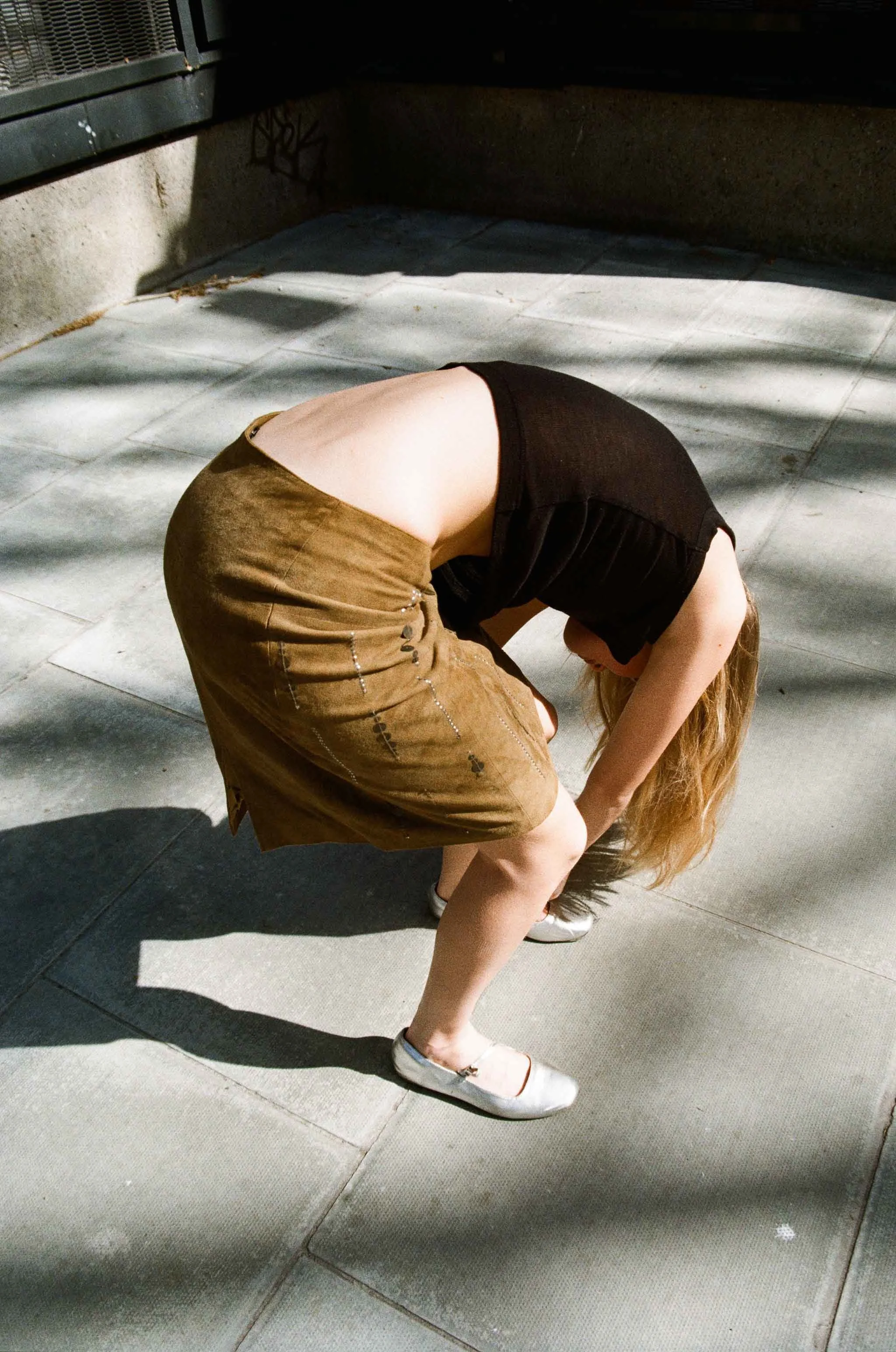 Art-directed fashion portrait photographed on film, exploring proportion, texture and contemporary visual storytelling.