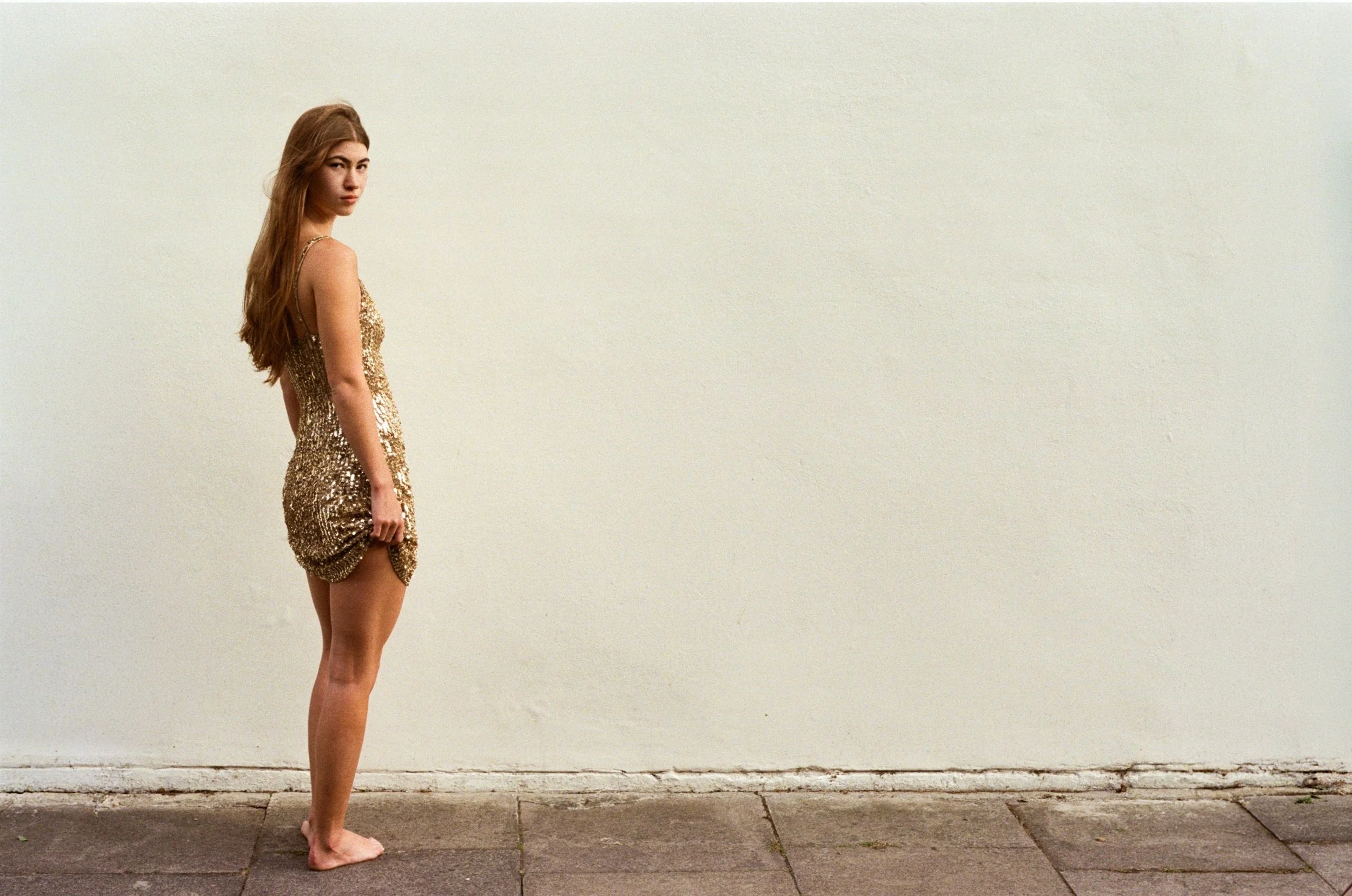 Editorial fashion portrait exploring contemporary styling, understated composition and authentic film grain.