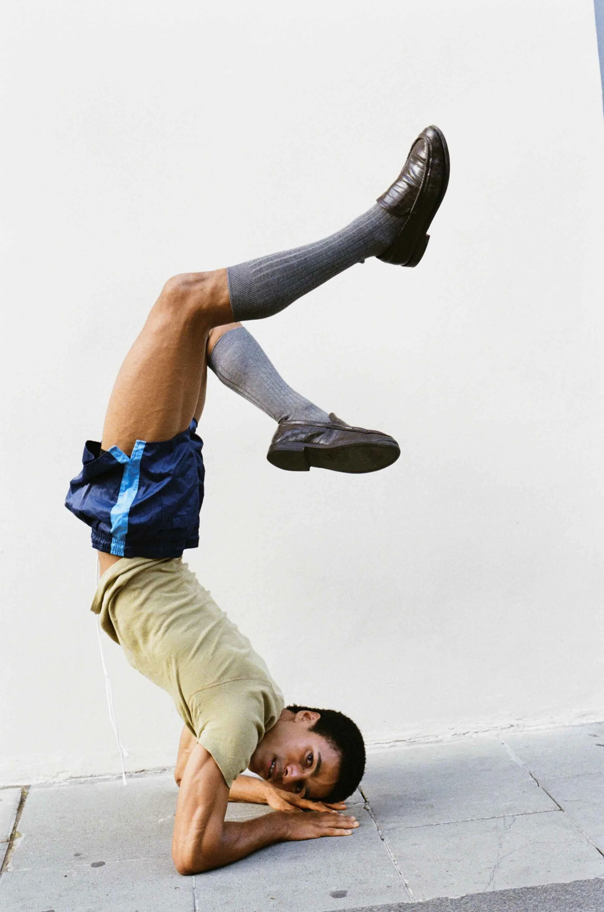 Art-directed fashion portrait photographed on film, exploring proportion, texture and contemporary visual storytelling.